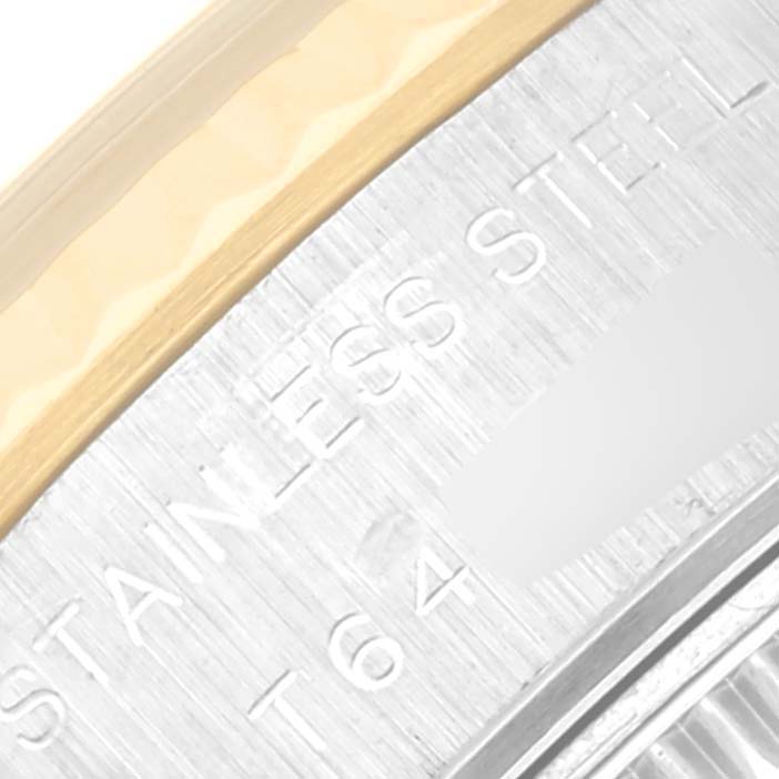 This image shows a close-up of the side inscription on a Rolex Datejust 69173 Women's Steel and Gold (two tone) Champagne Dial 69173 Women's Steel and Gold (two tone) Champagne Dial model, featuring markings and part of the bezel.