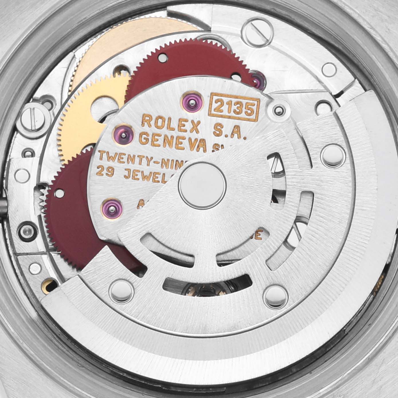 The image shows the internal movement mechanism of a Rolex Datejust 69173 Women's Steel and Gold (two tone) Champagne Dial 69173 Women's Steel and Gold (two tone) Champagne Dial watch, highlighting gears and the engraved text.