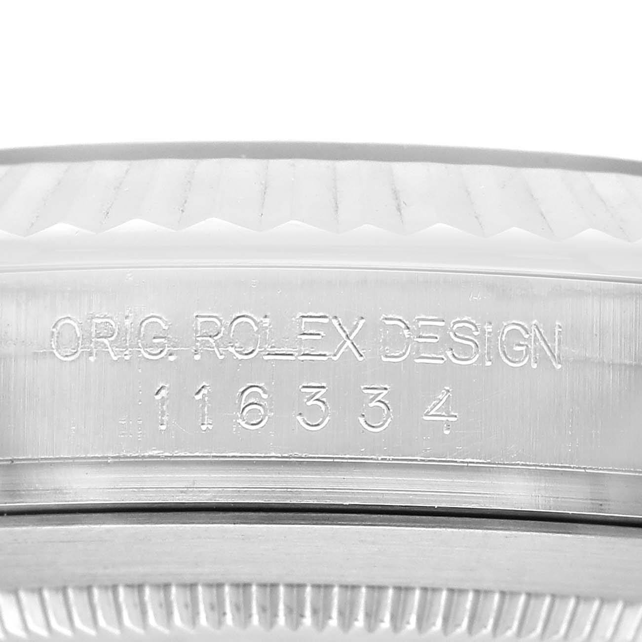 The image shows a close-up of the side of the Rolex Datejust 41 116334 Men's Stainless Steel Blue Dial, highlighting the bezel and engraved design number.
