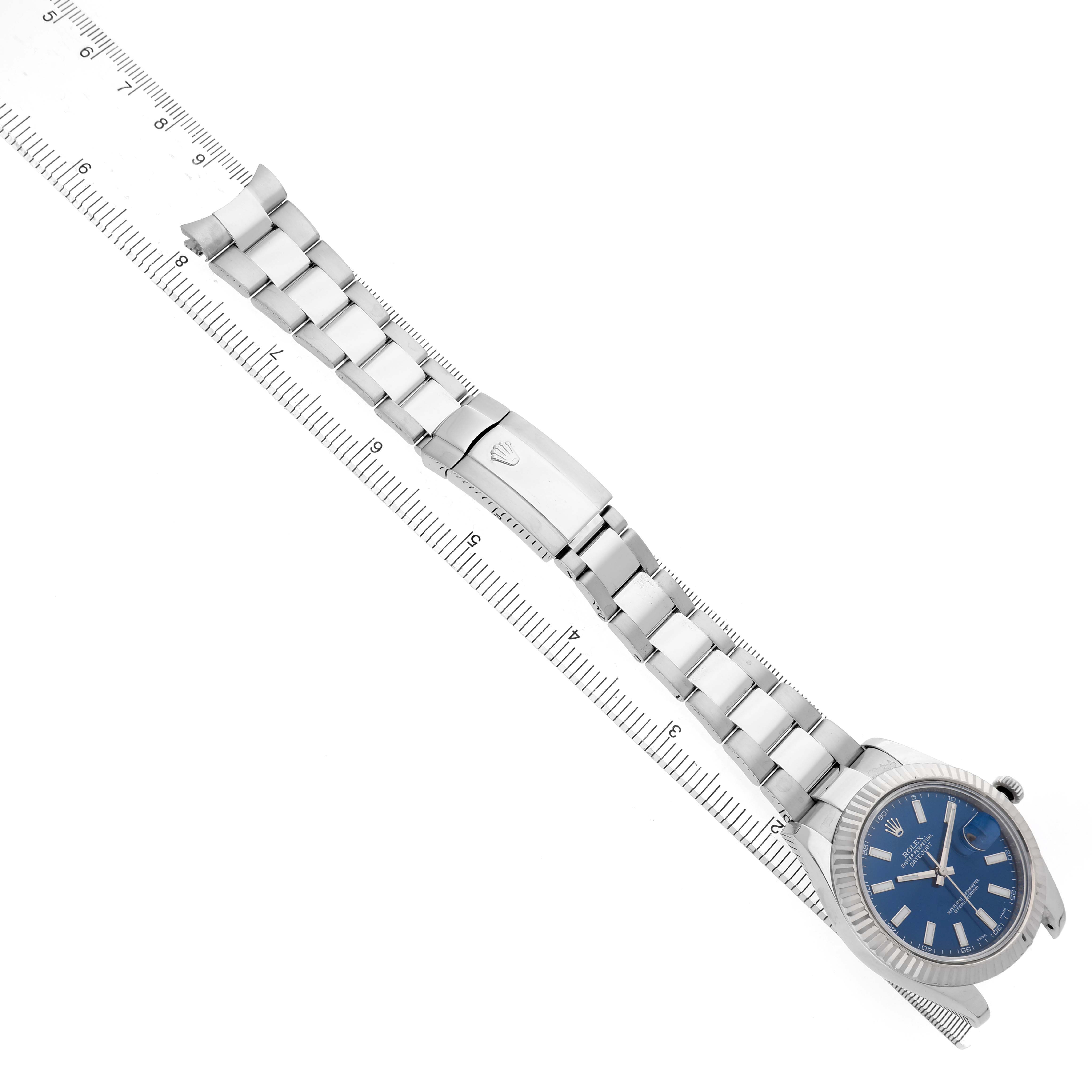 The Rolex Datejust 41 116334 Men's Stainless Steel Blue Dial is displayed at a diagonal angle, showing the bracelet, clasp, and blue dial.