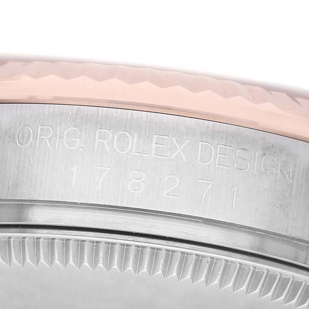 The image shows a close-up of the side profile of a Rolex Mid-Size 178271 Women's Steel and Gold (two tone) Pink Dial watch, highlighting the case with engraved model details.