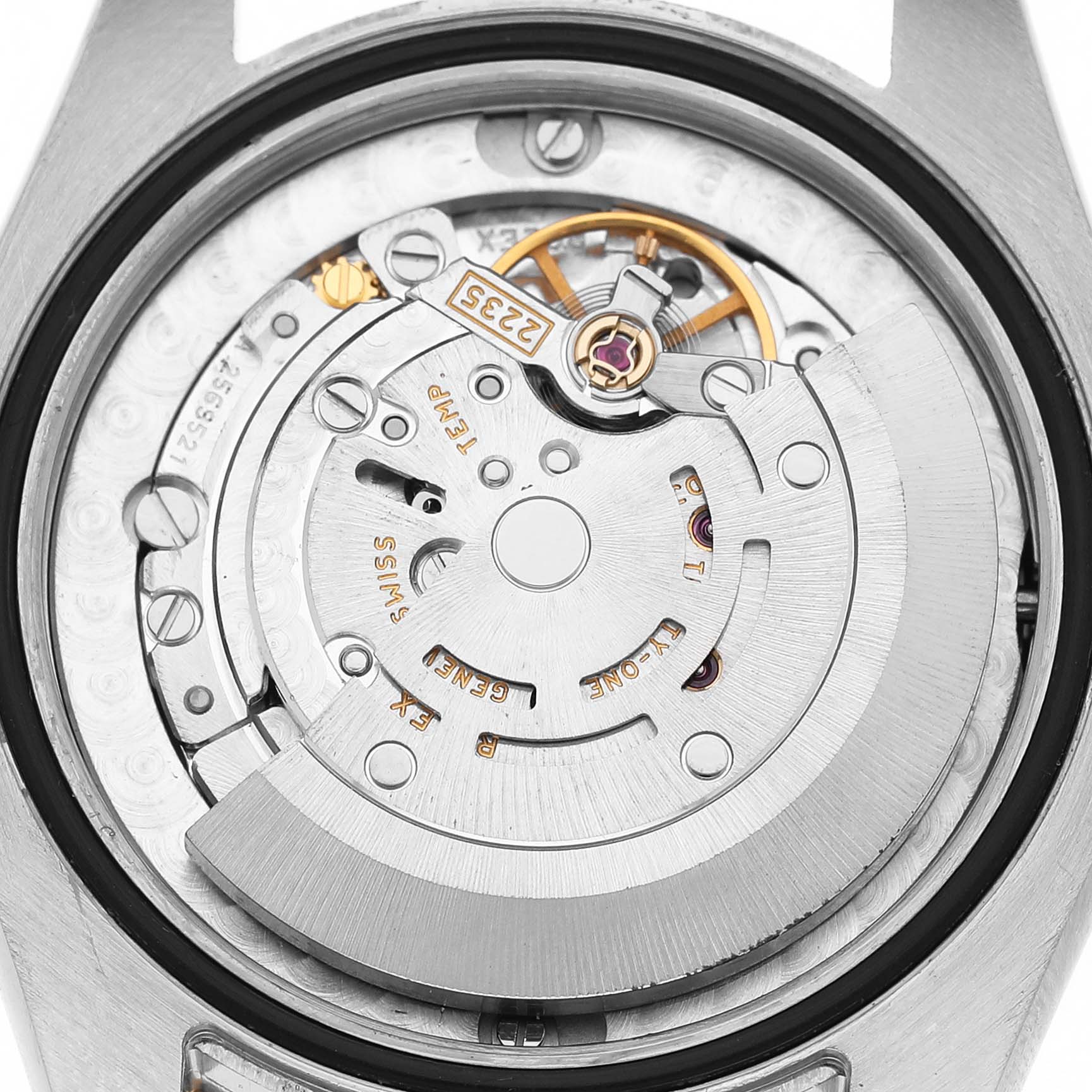 The image shows the movement mechanism of a Rolex Mid-Size 178273 Women's Steel and Gold (two tone) Silver Dial watch from the back, highlighting its intricate components.