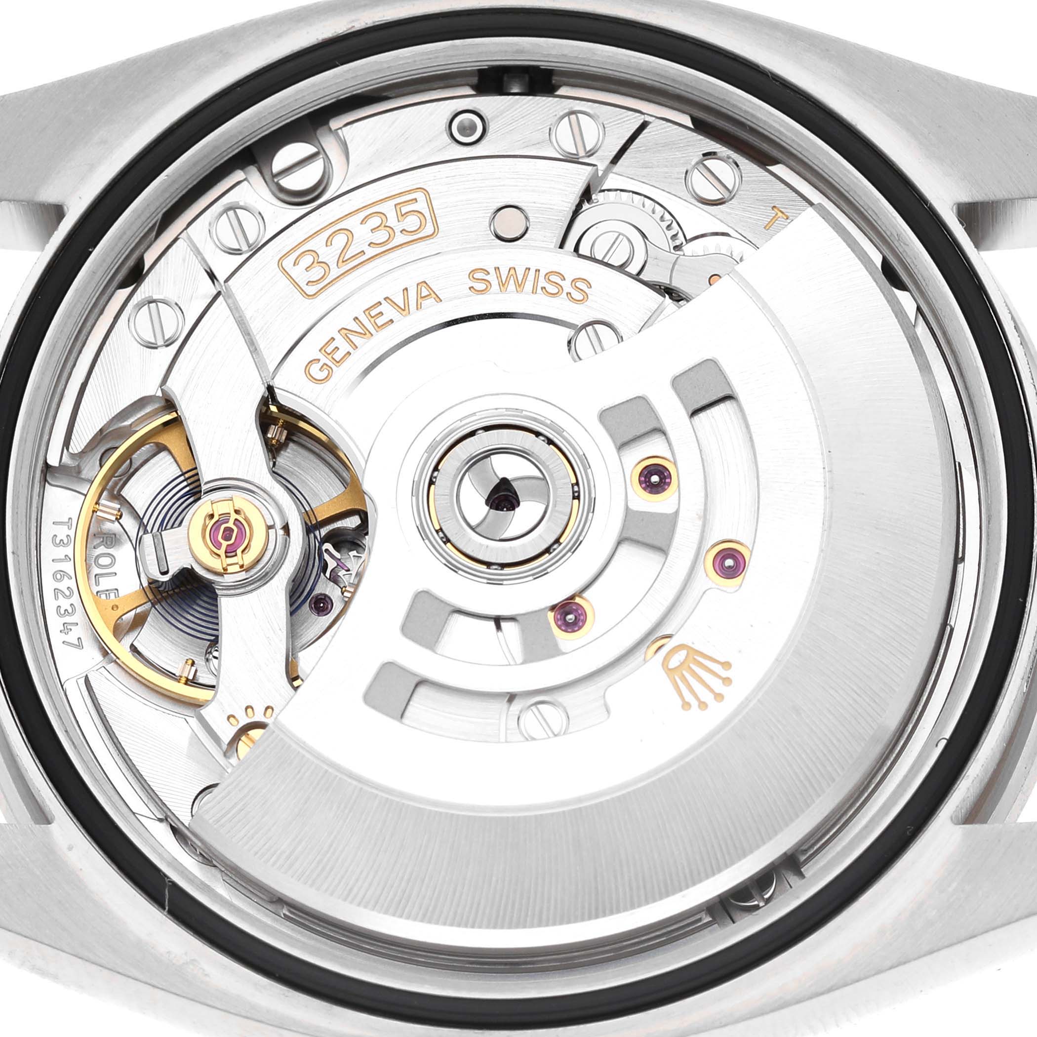 The image shows the back of a Rolex Datejust 126284 Men's Stainless Steel Pink Dial, highlighting the intricate movement mechanism.