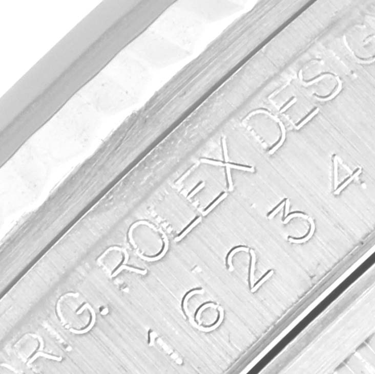 This image shows an engraving on the inner rim of the bezel for a Rolex Datejust 16234 Men's Stainless Steel Silver Dial 16234 Men's Stainless Steel Silver Dial watch.