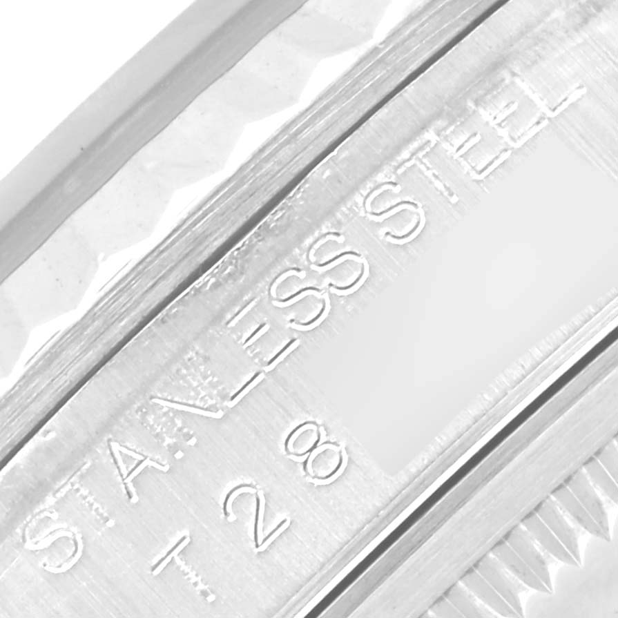 This image shows a close-up of the stainless steel bezel and engraved text on a Rolex Datejust 16234 Men's Stainless Steel Silver Dial 16234 Men's Stainless Steel Silver Dial watch.