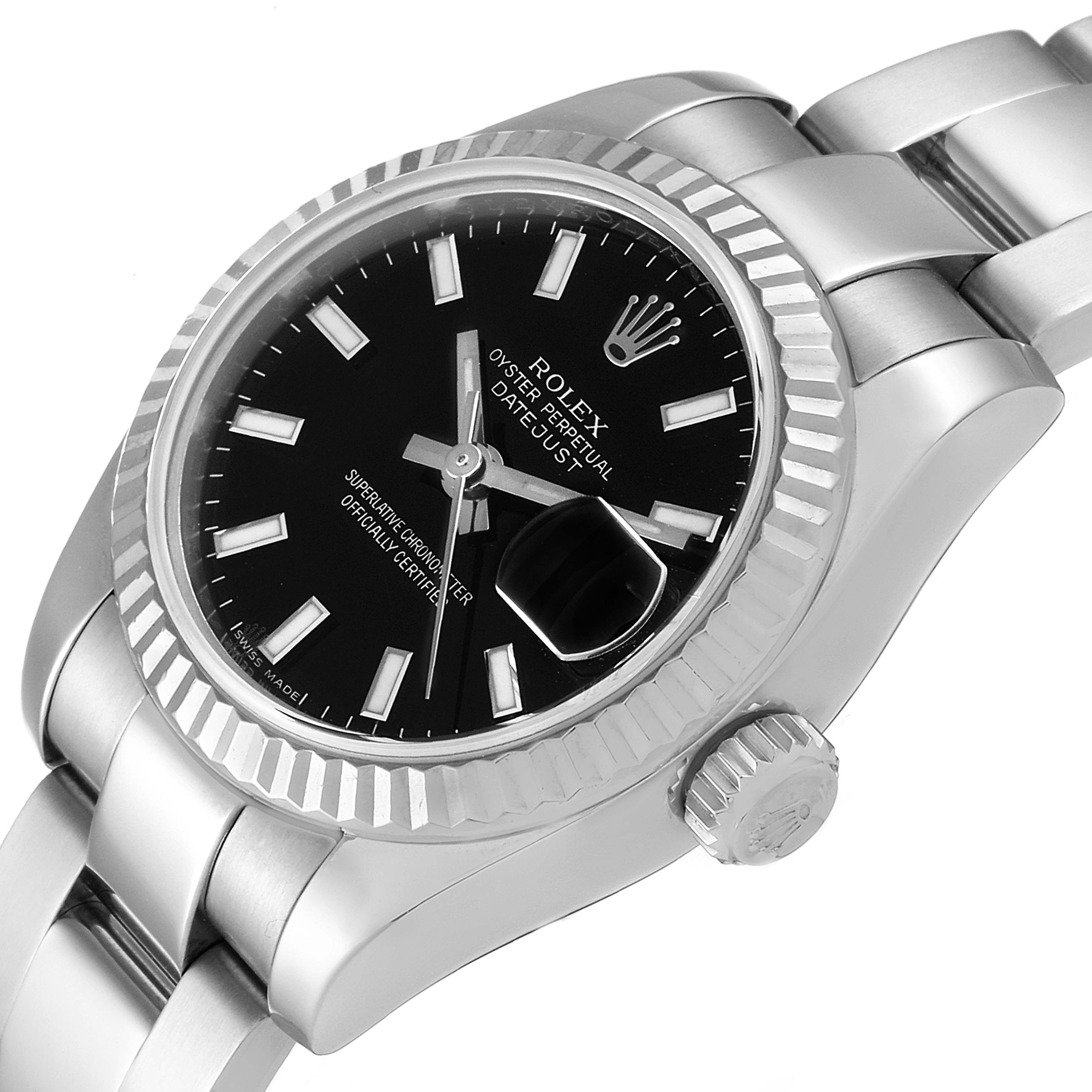 This image shows a close-up of the Rolex Datejust 179174 Women's Stainless Steel Black Dial 179174 Women's Stainless Steel Black Dial watch's face, bezel, crown, and part of the bracelet at a slight angle.