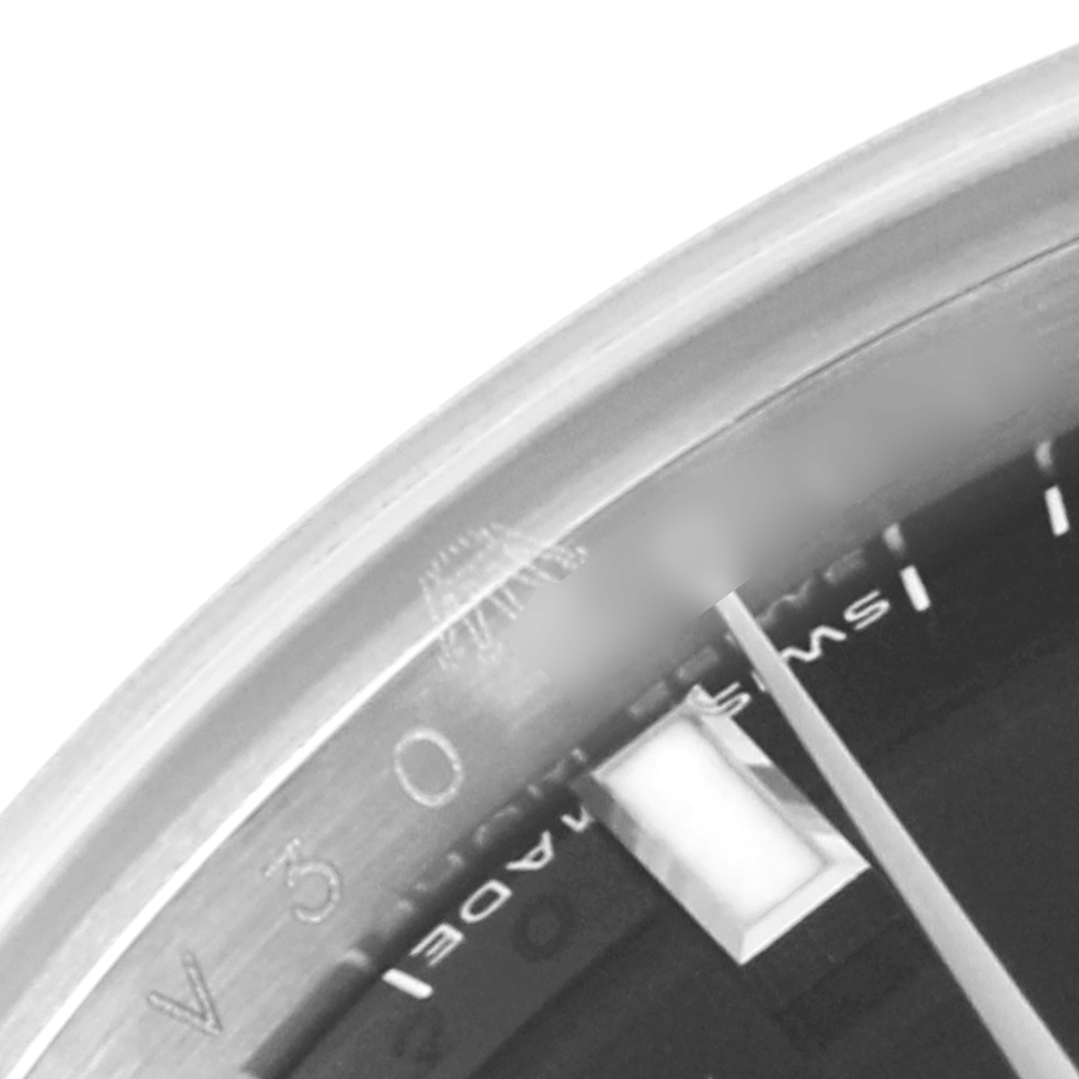 The image shows a close-up of the dial and bezel of a Rolex Datejust 179174 Women's Stainless Steel Black Dial 179174 Women's Stainless Steel Black Dial watch, highlighting part of the face and hour markers.