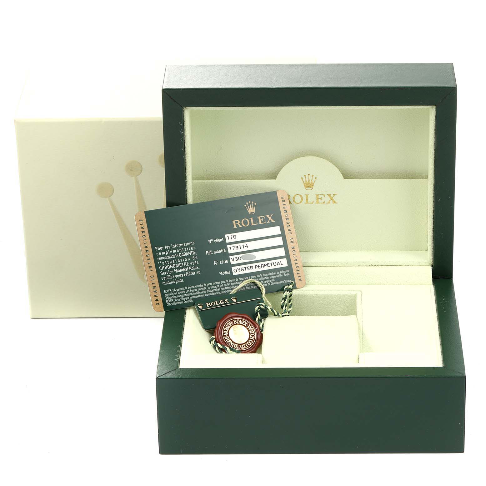The image shows an open Rolex Datejust 179174 Women's Stainless Steel Black Dial 179174 Women's Stainless Steel Black Dial watch box with a warranty card and a tag inside.
