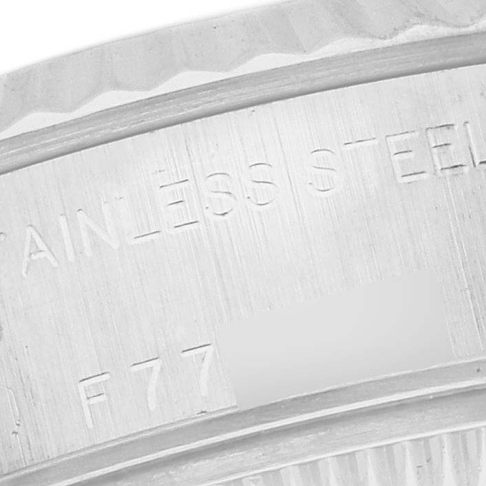 This close-up image shows a partial view of the back case of a Rolex Datejust 79174 Women's Stainless Steel Silver Dial 79174 Women's Stainless Steel Silver Dial watch, highlighting the "STAINLESS STEEL" engraving.