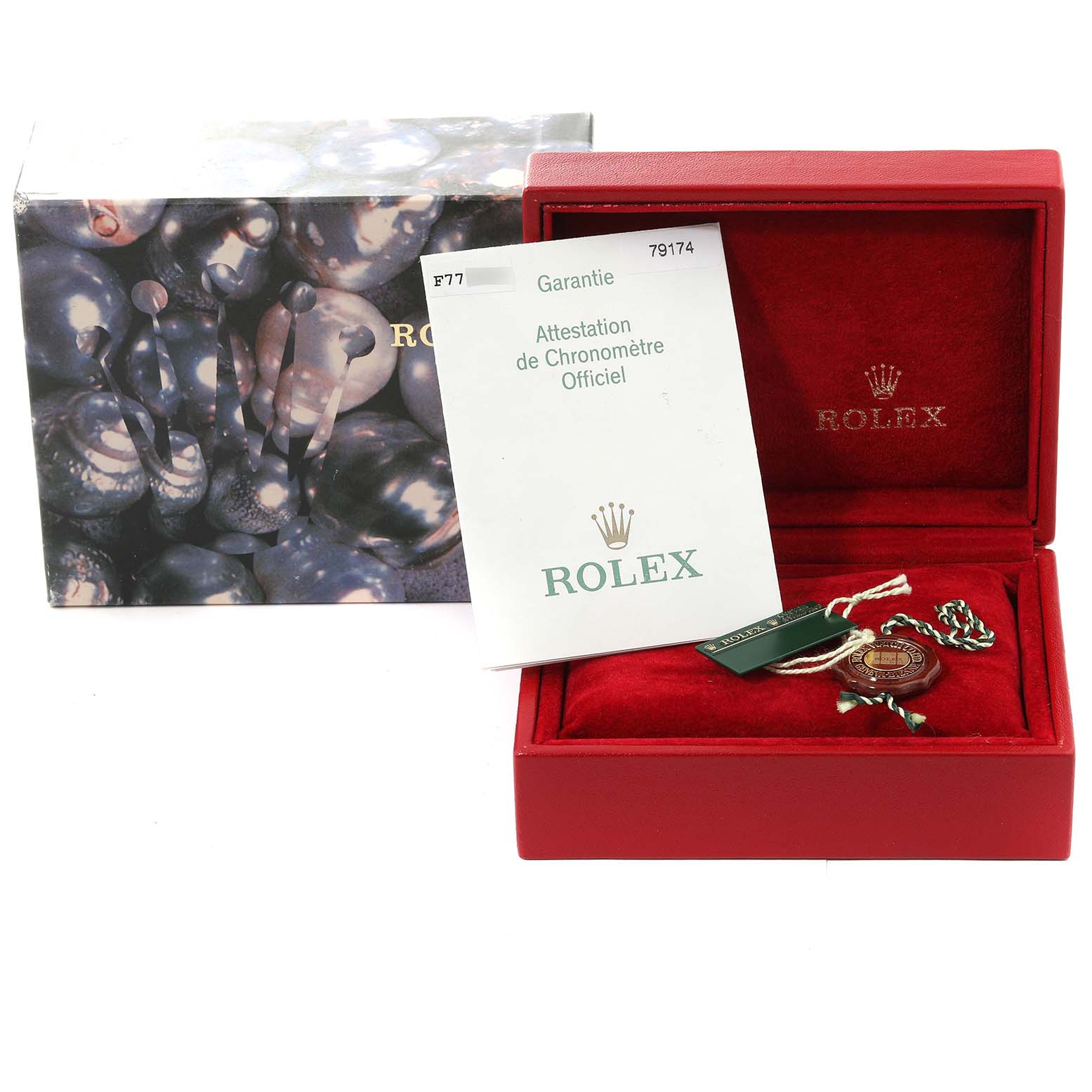 The image shows a Rolex Datejust 79174 Women's Stainless Steel Silver Dial 79174 Women's Stainless Steel Silver Dial model watch box with accessories including the guarantee certificate and a tag, all viewed from the front.
