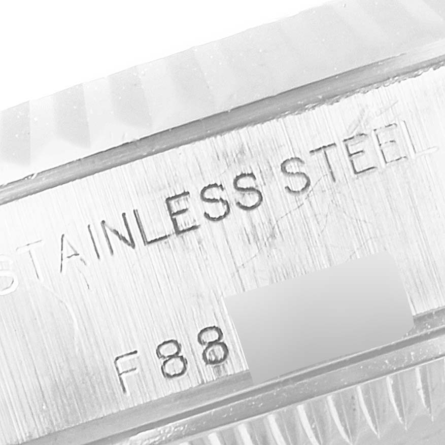 This close-up image shows the engraving on the side of a Rolex Datejust 79174 Women
s Stainless Steel Silver Dial 79174 Women
s Stainless Steel Silver Dial
s stainless steel case.