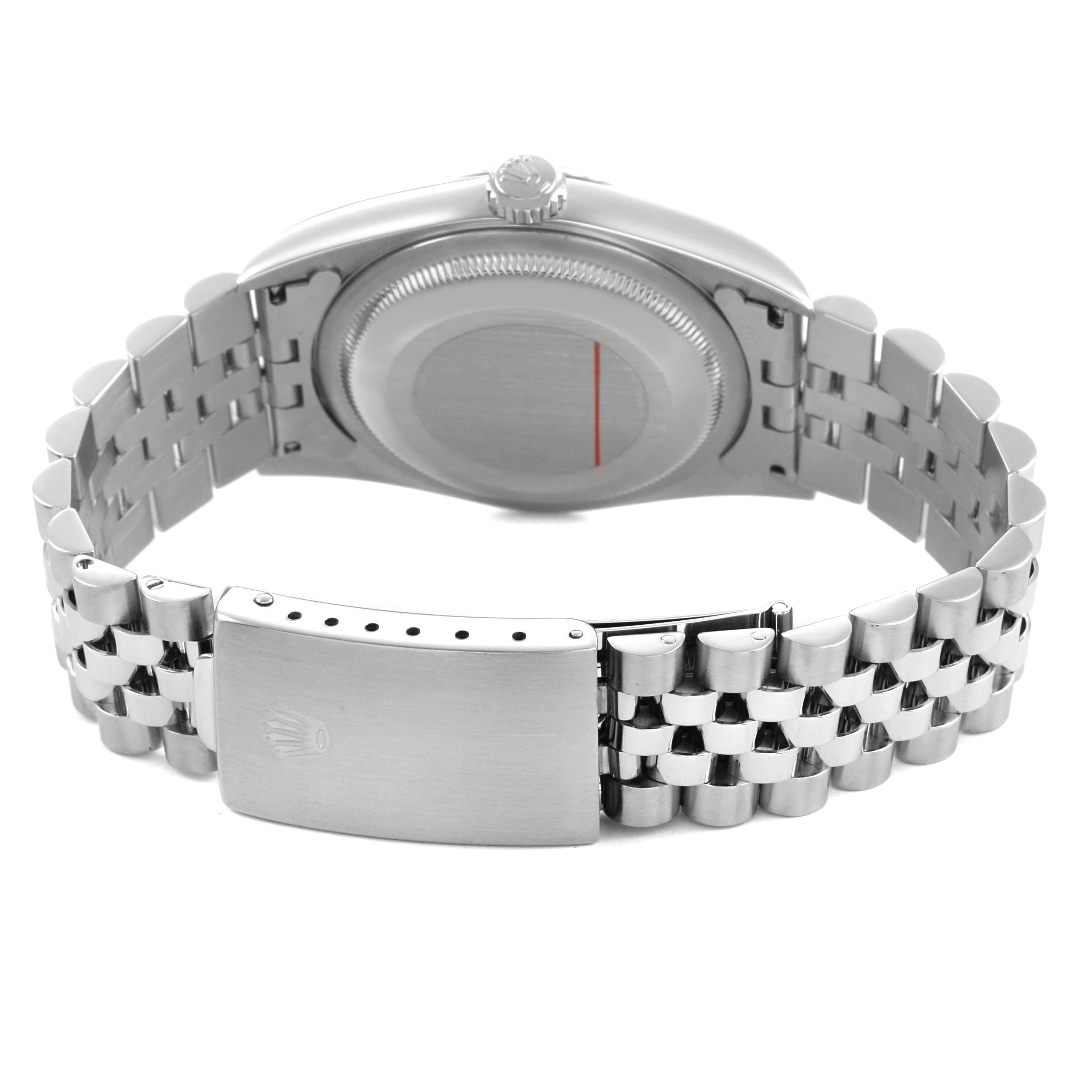 The Rolex Datejust 16234 Men's Stainless Steel Silver Dial watch is shown from the back, highlighting the case back and Jubilee bracelet.