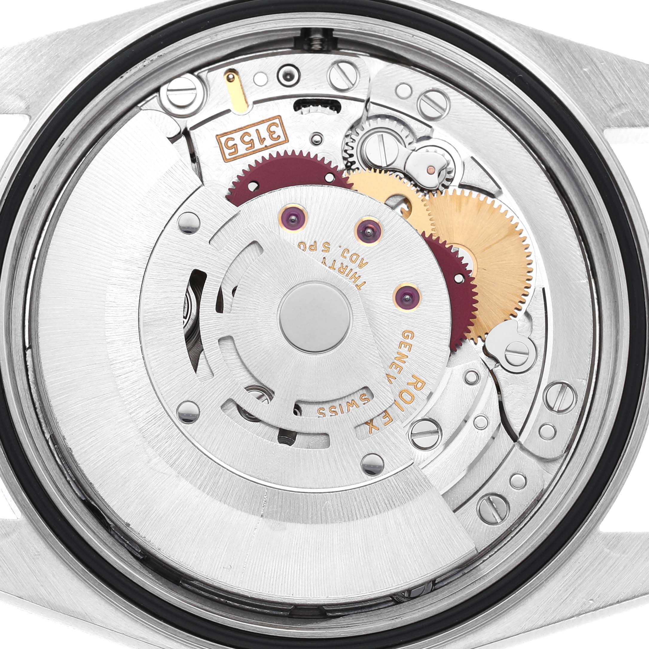 The image shows the movement and inner workings of a Rolex Datejust 16234 Men's Stainless Steel Silver Dial watch from the back angle.