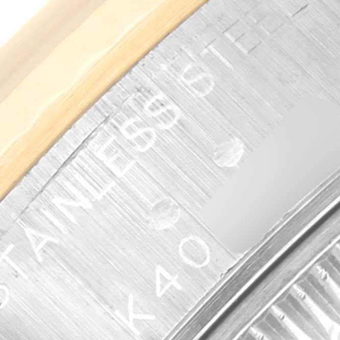 This close-up image shows the stainless steel and gold bezel of the Rolex Datejust 79173 Women's Steel and Gold (two tone) Champagne Dial 79173 Women's Steel and Gold (two tone) Champagne Dial watch with partial engraving visible.