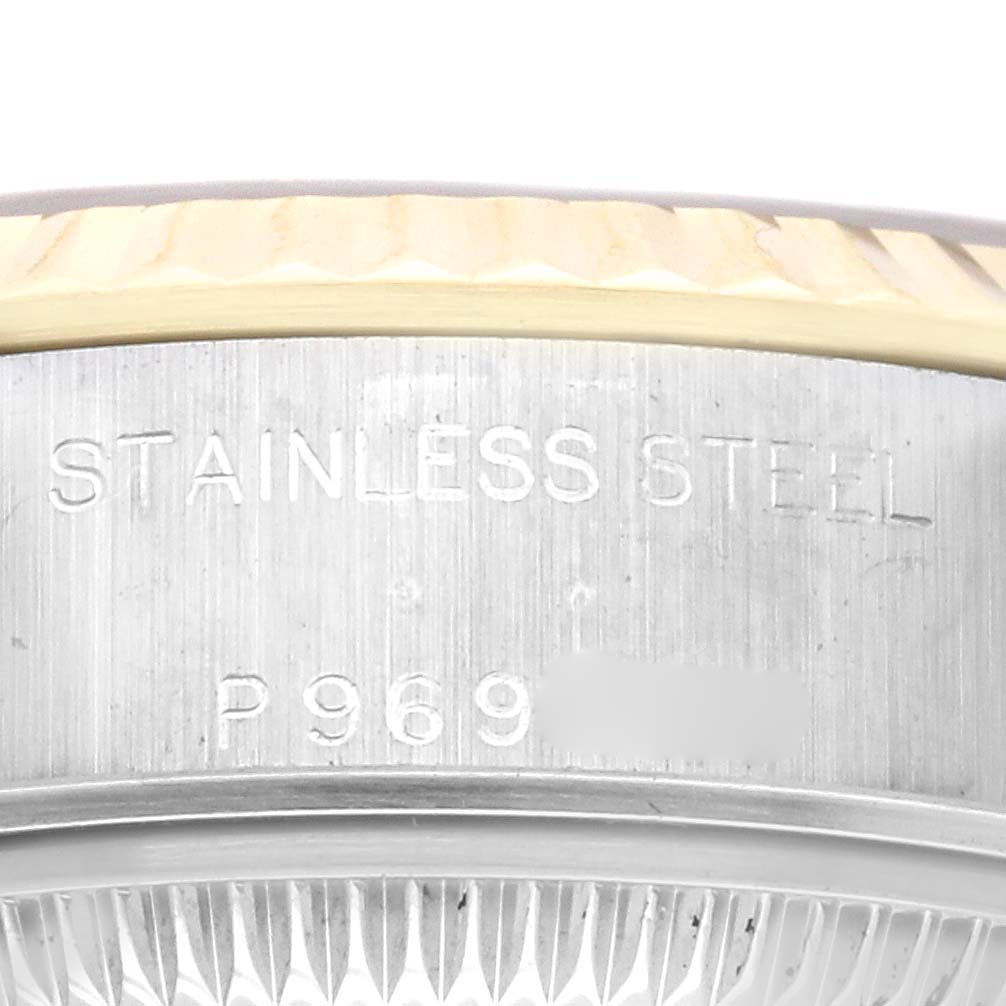 The image shows the side of the casing and part of the bezel of a Rolex Datejust 79173 Women's Steel and Gold (two tone) Champagne Dial 79173 Women's Steel and Gold (two tone) Champagne Dial watch, highlighting the "STAINLESS STEEL" engraving.