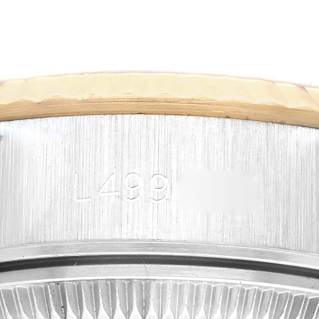 This image shows a close-up of the serial number area near the bezel on a Rolex Datejust 69173 Women's Steel and Gold (two tone) Champagne Dial 69173 Women's Steel and Gold (two tone) Champagne Dial watch.
