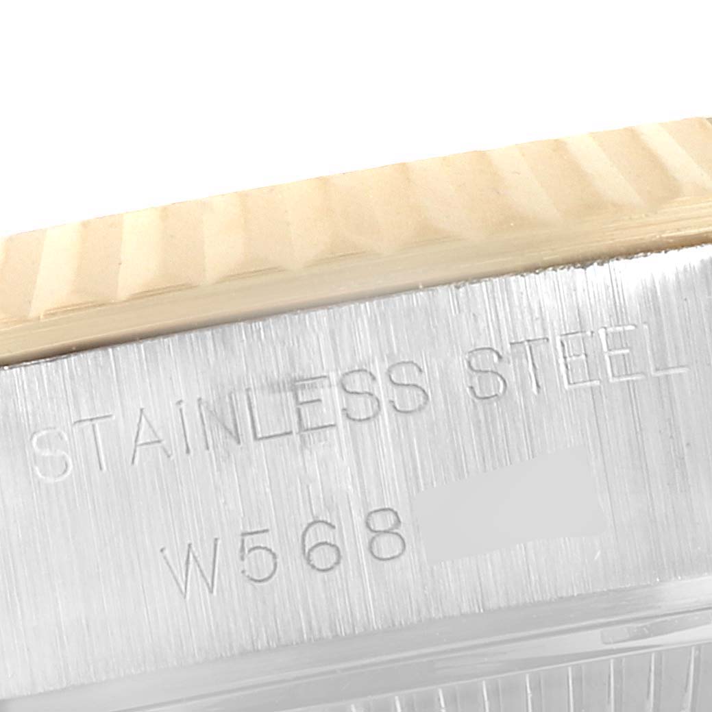 This image shows a close-up view of the stainless steel case and the fluted bezel of a Rolex Datejust 69173 Women
s Steel and Gold (two tone) Beige Dial 69173 Women
s Steel and Gold (two tone) Beige Dial watch.