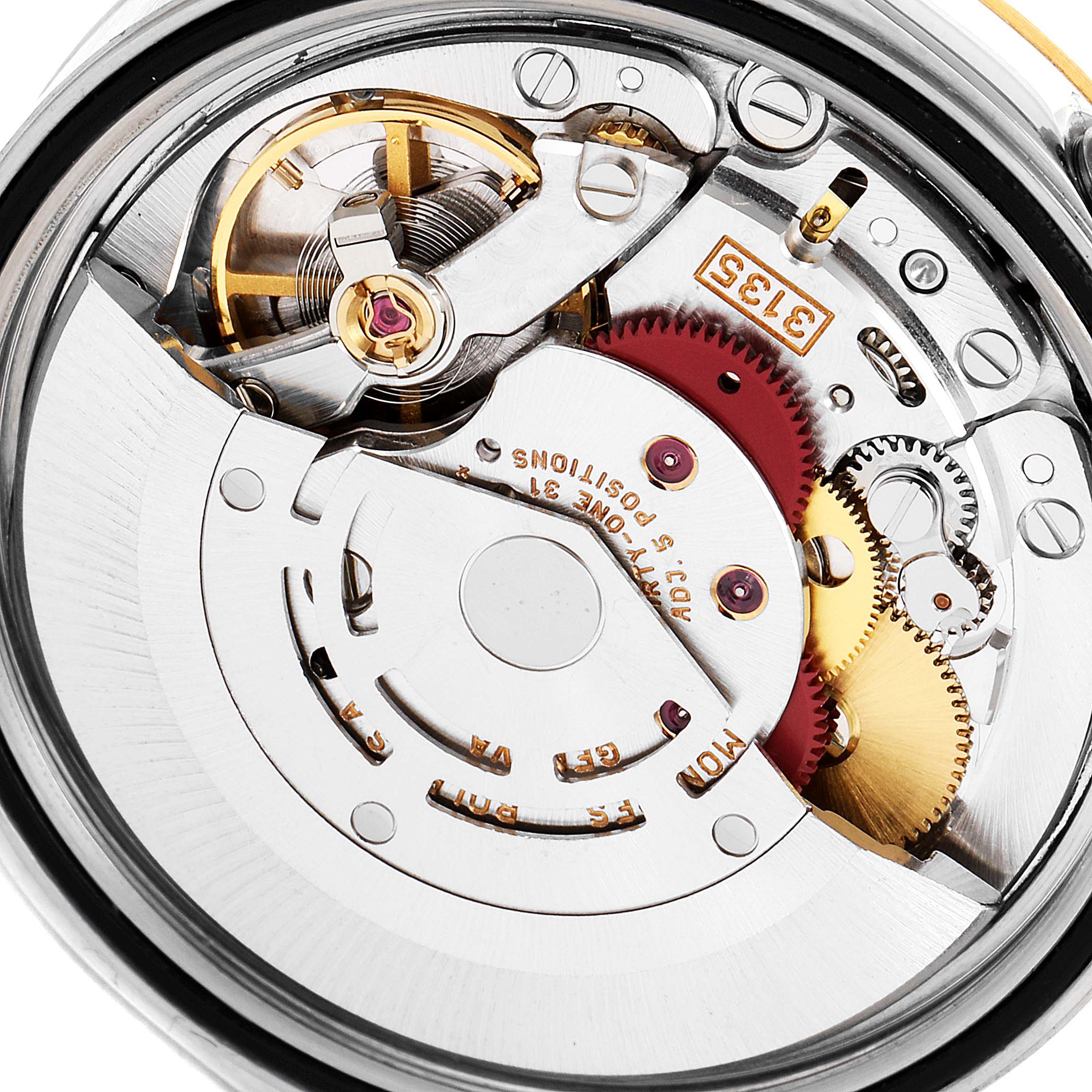 This is a close-up view of the movement mechanism inside a Rolex Datejust 16233 Men's Steel and Gold (two tone) Mother of Pearl Dial 16233 Men's Steel and Gold (two tone) Mother of Pearl Dial watch.