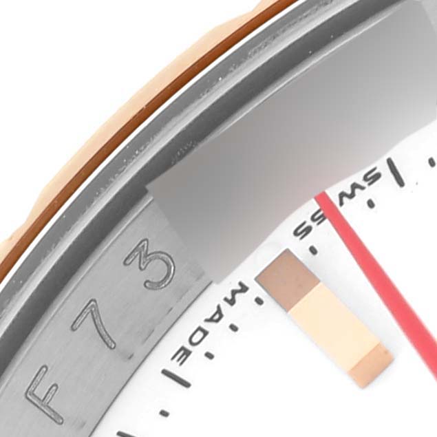 This image shows a close-up view of the bezel and dial of the Rolex Turn-o-Graph 116261 Men's Steel and Gold (two tone) White Dial 116261 Men's Steel and Gold (two tone) White Dial watch.