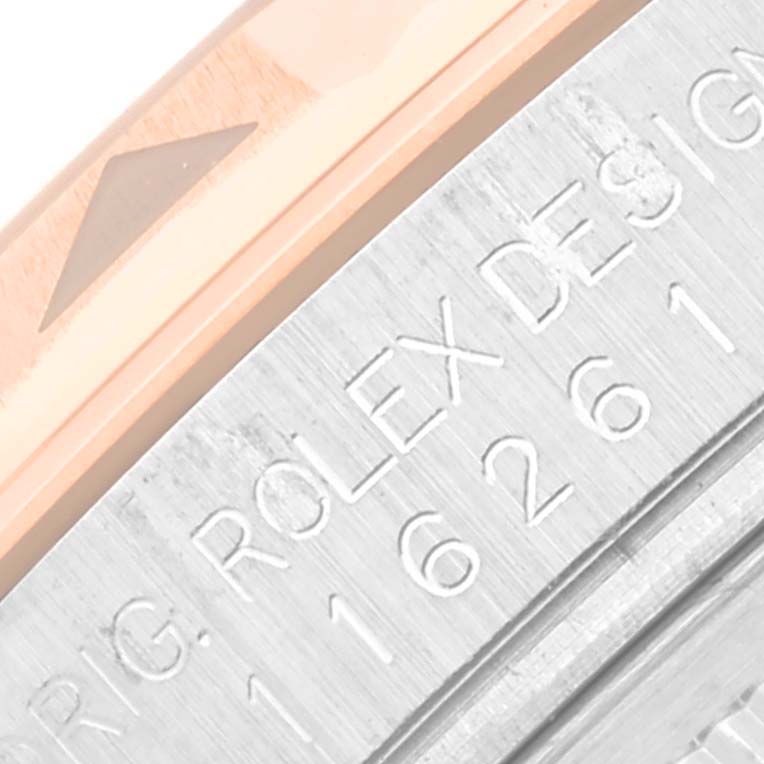 The image shows a close-up of the edge and engraving on a Rolex Turn-o-Graph 116261 Men's Steel and Gold (two tone) White Dial 116261 Men's Steel and Gold (two tone) White Dial watch bezel and case.