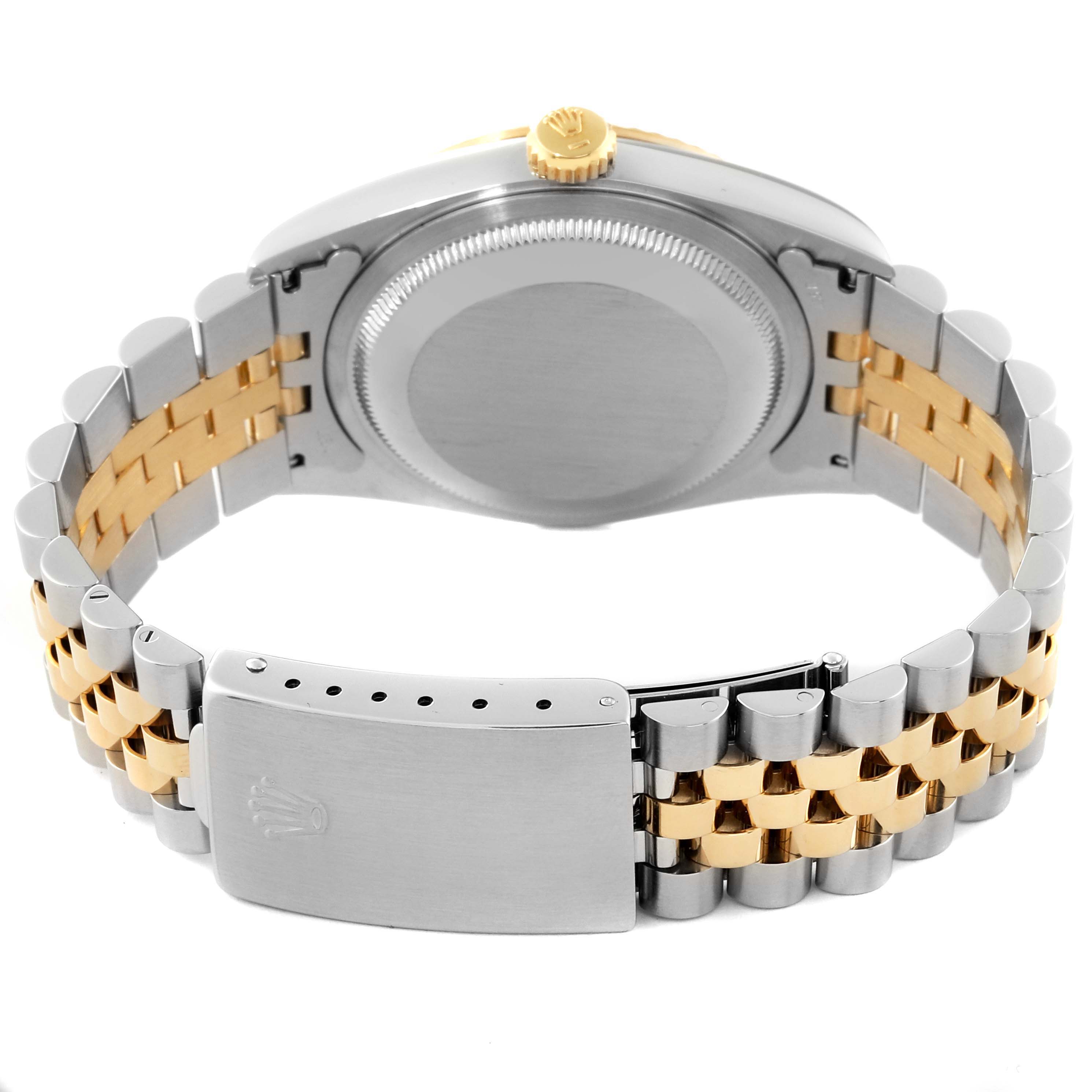 The image shows the back of a Rolex Datejust 16233 Men's Steel and Gold (two tone) White Dial 16233 Men's Steel and Gold (two tone) White Dial watch, highlighting its clasp mechanism and two-tone bracelet.