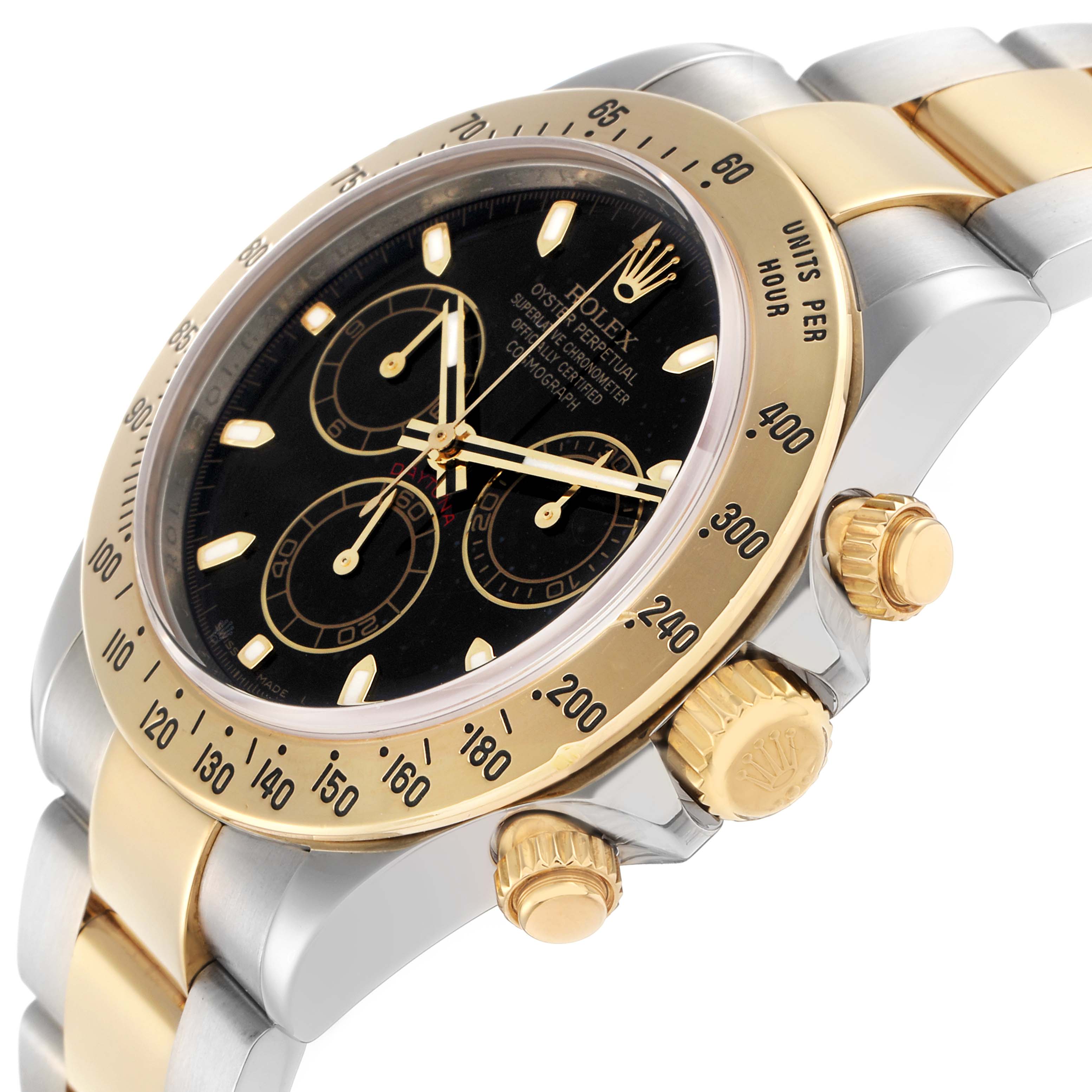 The Rolex Daytona 116523 Men
s Steel and Gold (two tone) Black Dial watch is shown from a side angle, highlighting the bezel, dial, crown, and bracelet.