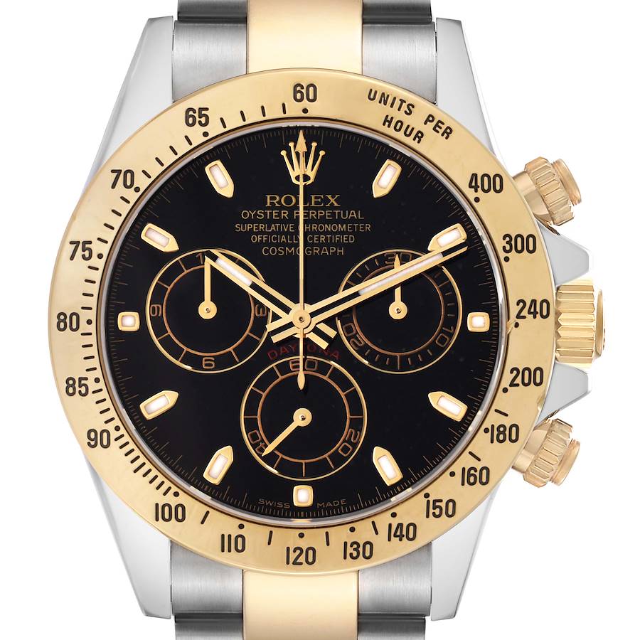 The Rolex Daytona model 116523 men's watch is shown from a front angle, highlighting the black dial, gold bezel with tachymetric scale, and the two-tone bracelet.