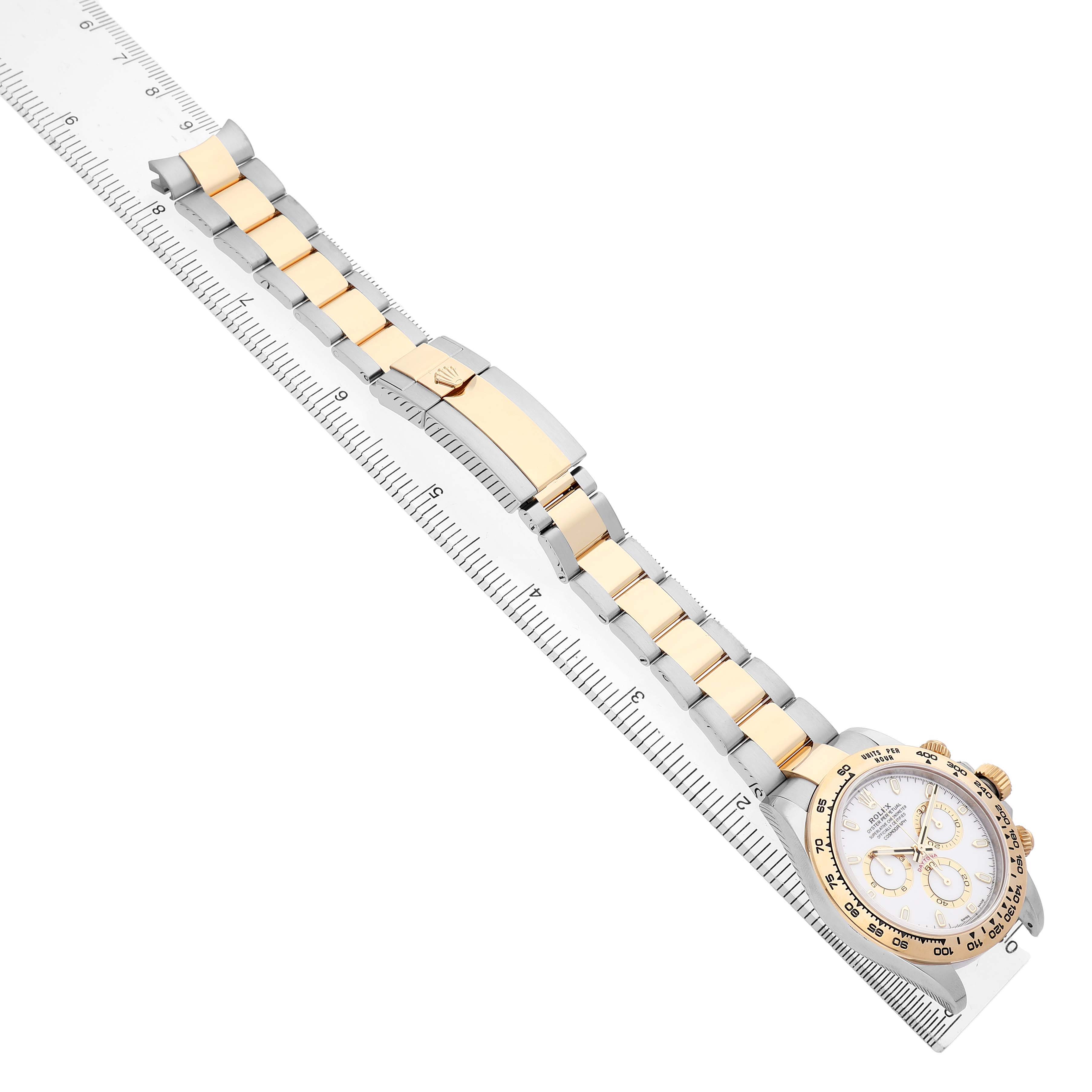The Rolex Daytona 116503 Men's Steel and Gold (two tone) White Dial watch is shown at a diagonal angle, displaying its full band, clasp, and face.