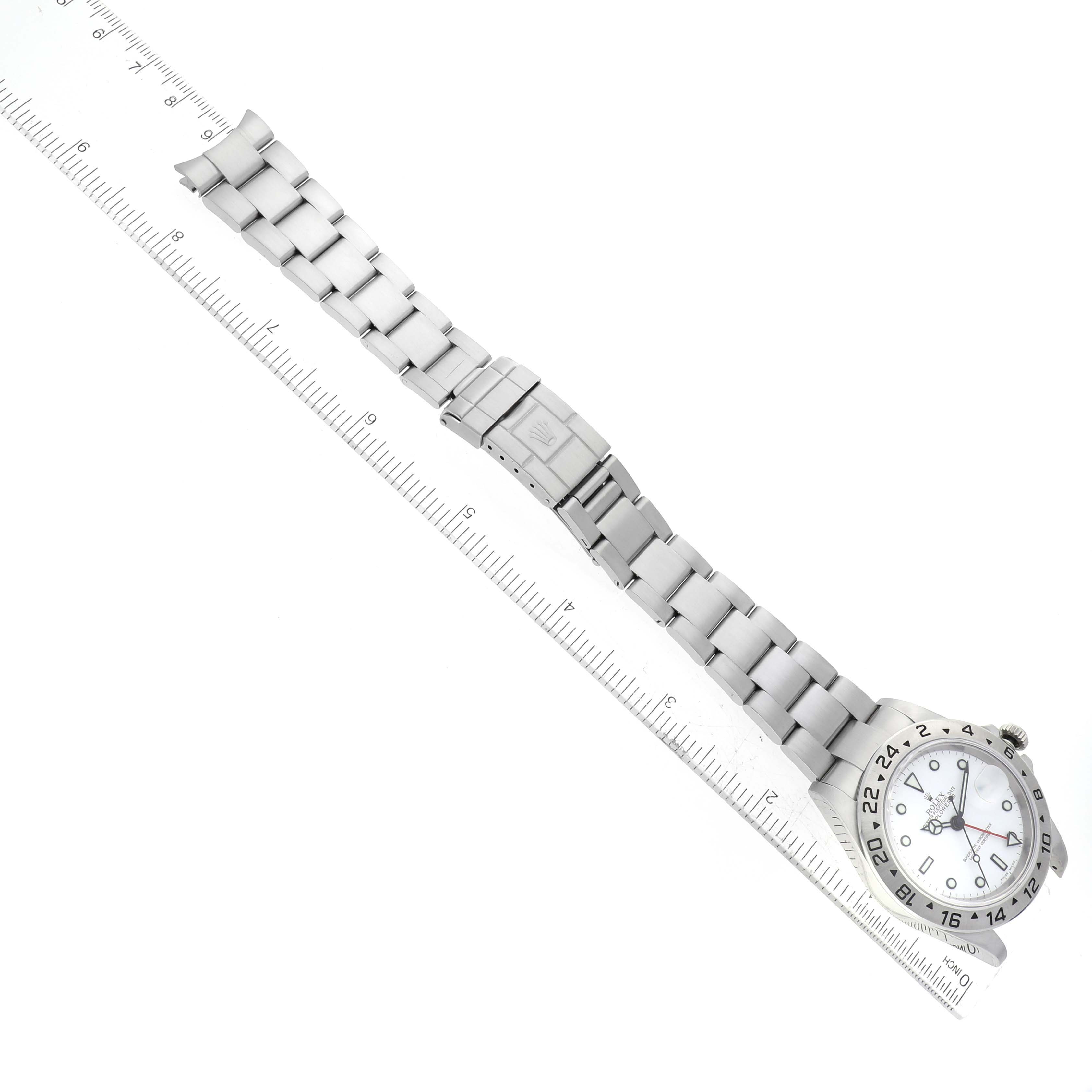 The Rolex Explorer 16570 Men's Stainless Steel White Dial 16570 Men's Stainless Steel White Dial model watch is shown from a top-down angle, displaying the face, bezel, clasp, and bracelet.