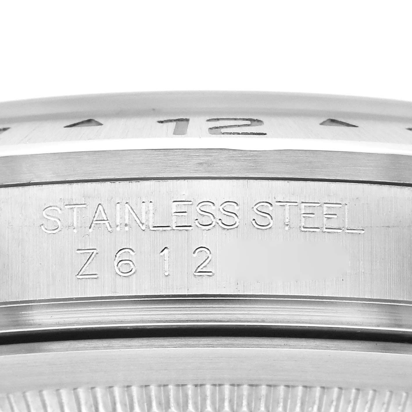 This close-up image of a Rolex Explorer 16570 Men's Stainless Steel White Dial 16570 Men's Stainless Steel White Dial watch shows the engraving on the side of the stainless steel case.
