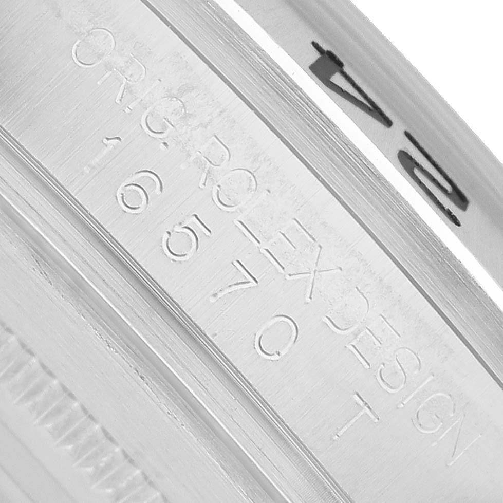 The image shows a close-up of the engraved inner bezel of a Rolex Explorer 16570 Men's Stainless Steel White Dial watch, focusing on the model number.
