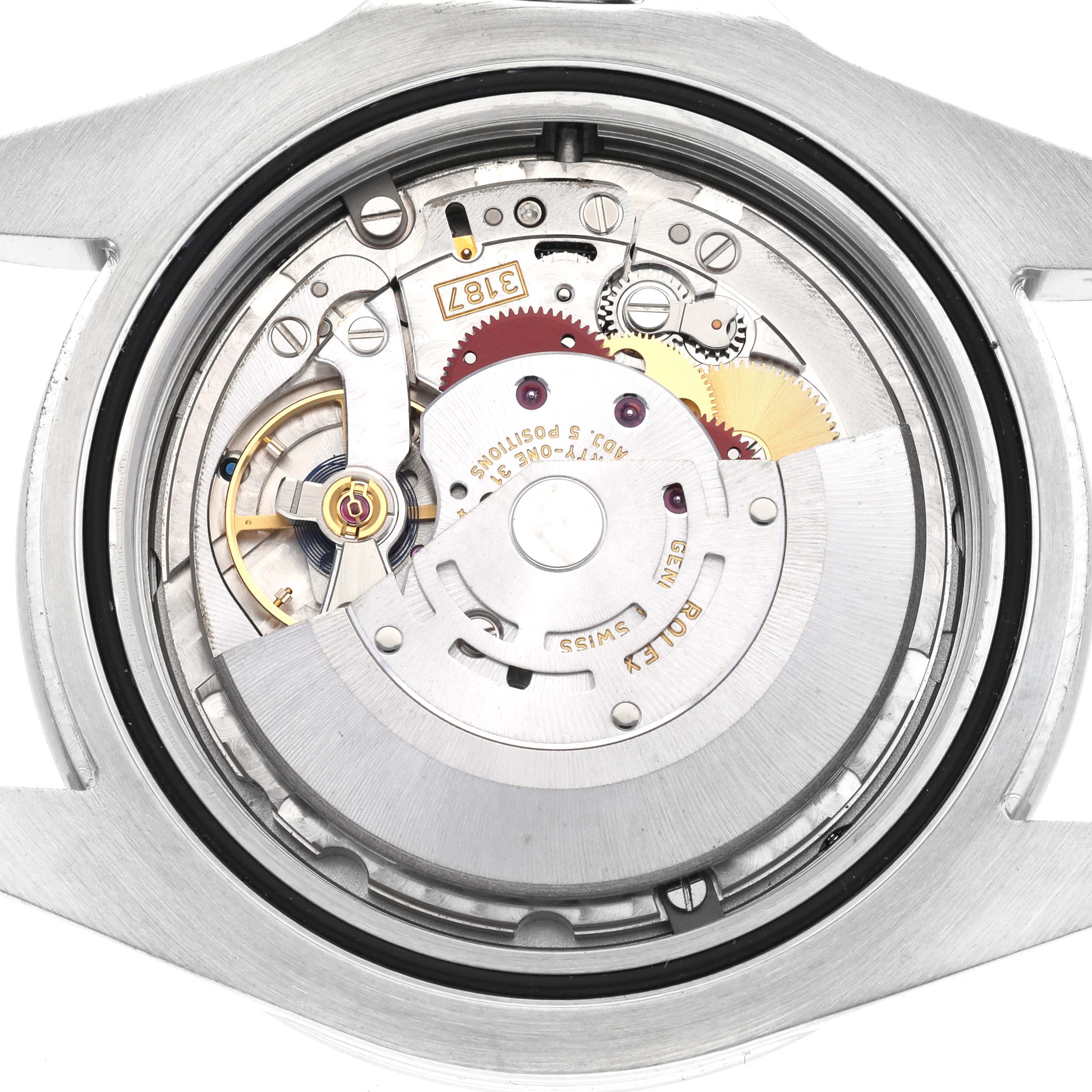 The image shows the internal mechanical movement of the Rolex Explorer 216570 Men's Stainless Steel White Dial 216570 Men's Stainless Steel White Dial watch from a rear angle, with visible gears and parts.