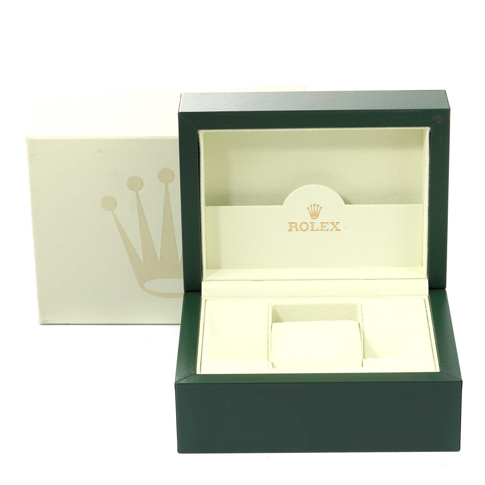 The image shows a green and cream-colored Rolex GMT-Master 116710 Men's Stainless Steel Black Dial 116710 Men's Stainless Steel Black Dial watch box with an open lid and an interior cushion.