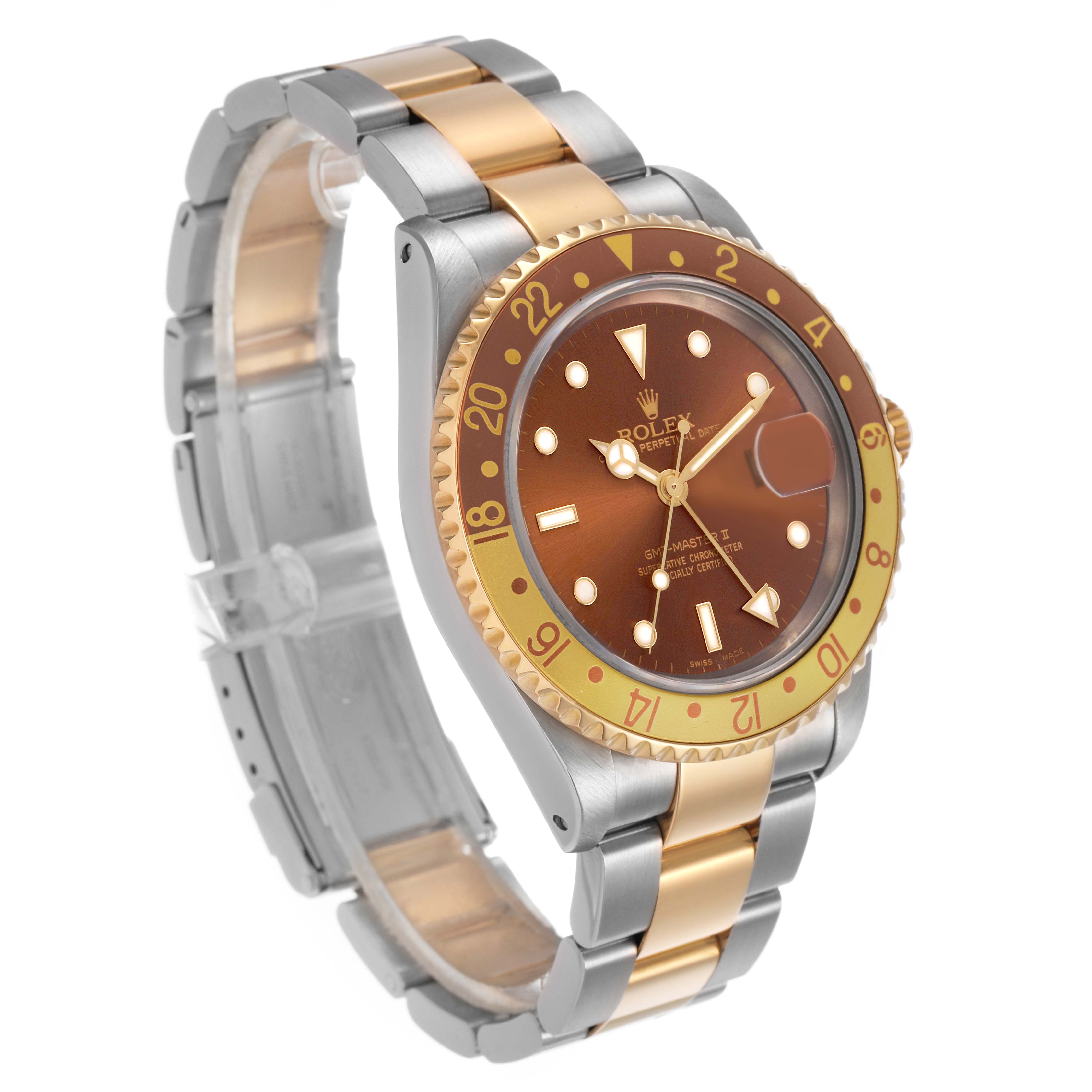 The Rolex GMT-Master 16713 Men's Steel and Gold (two tone) Brown Dial watch is shown at a three-quarter angle, highlighting the dial, bezel, and two-tone bracelet.