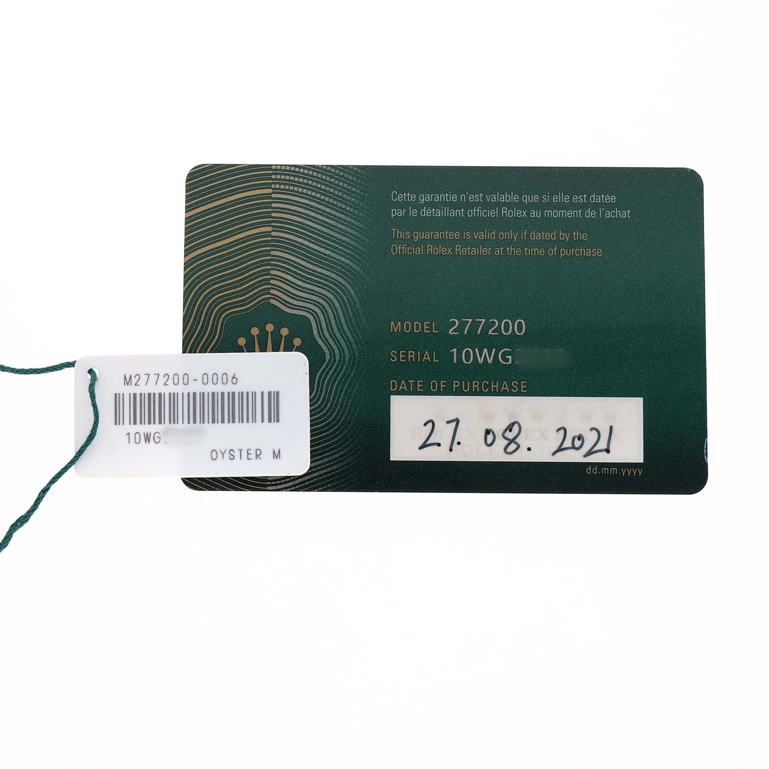 The image shows a Rolex warranty card for the Mid-Size model, with model, serial number, and purchase date visible.