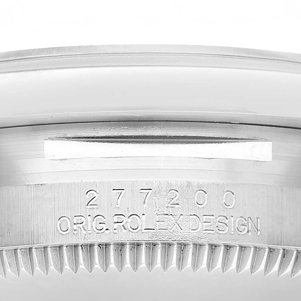 The image shows the side view of a Rolex Mid-Size 277200 Women's Stainless Steel Green Dial model, focusing on the metal casing with the model number and "ORIG ROLEX DESIGN" engraved.