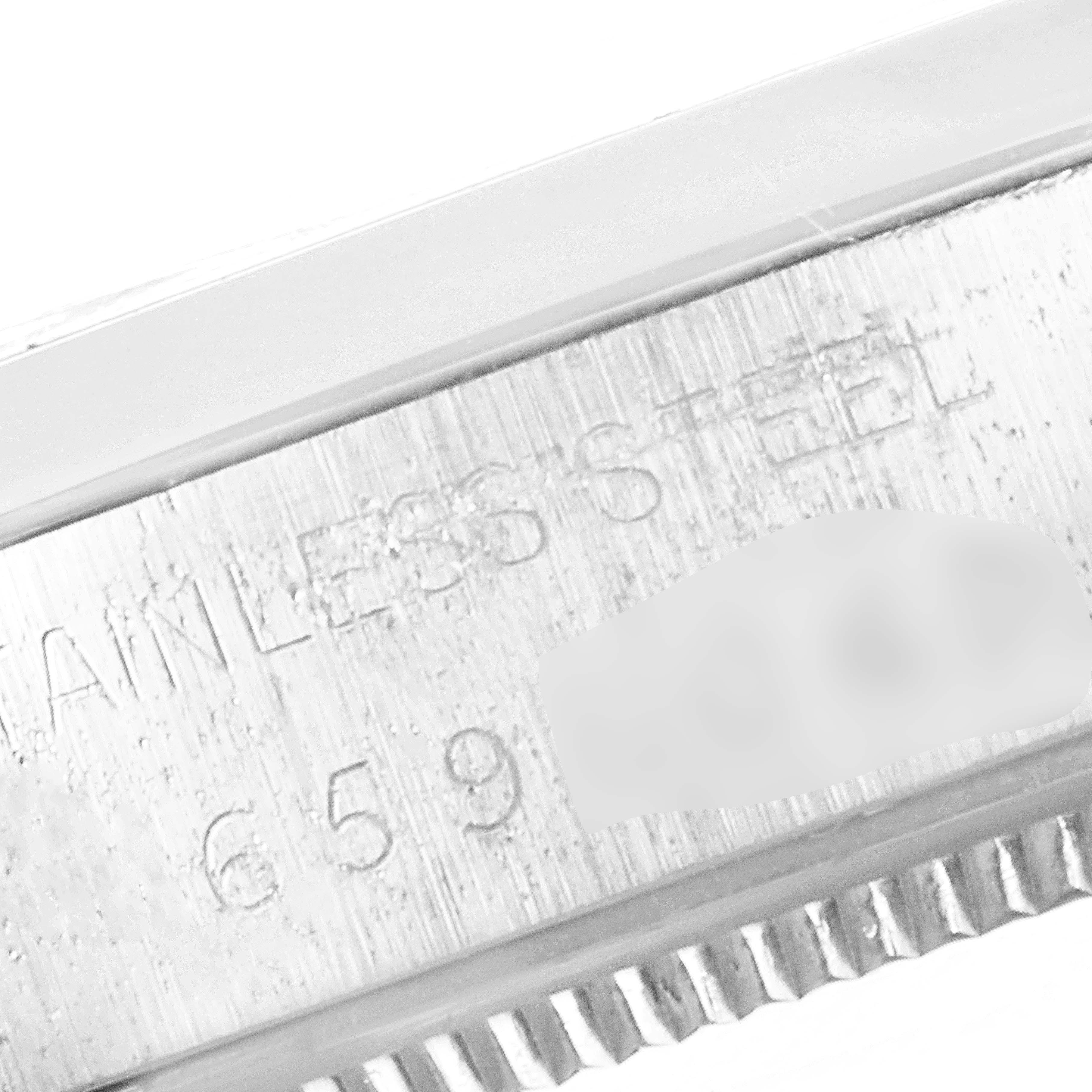 The image shows a close-up angle of the stainless steel casing edge of a Rolex Vintage Collection 5500 Men
s Stainless Steel Silver Dial 5500 Men
s Stainless Steel Silver Dial model watch.