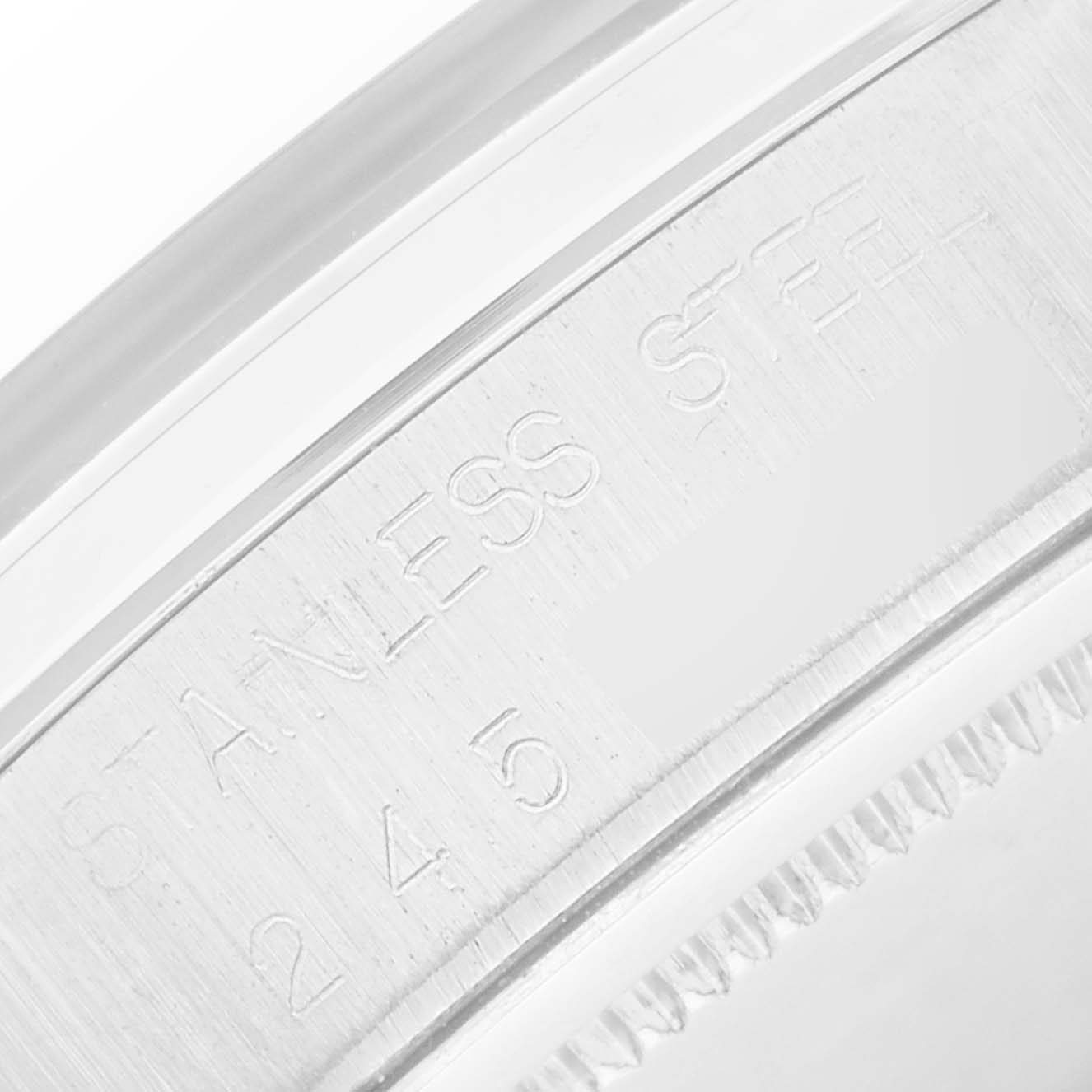 The image shows the side engraving of the case on a Rolex Vintage Collection 6694 Men
s Stainless Steel White Dial watch, highlighting the "STAINLESS STEEL" marking.