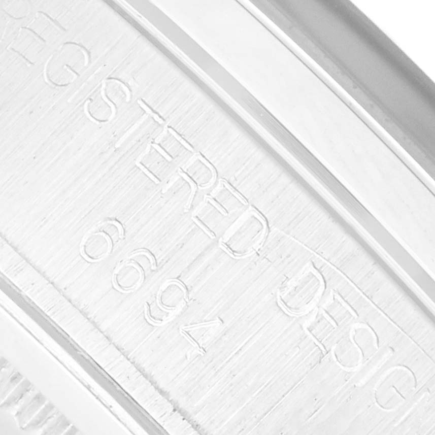 The image shows a close-up of the case back engraving of the Rolex Vintage Collection 6694 Men
s Stainless Steel White Dial watch.