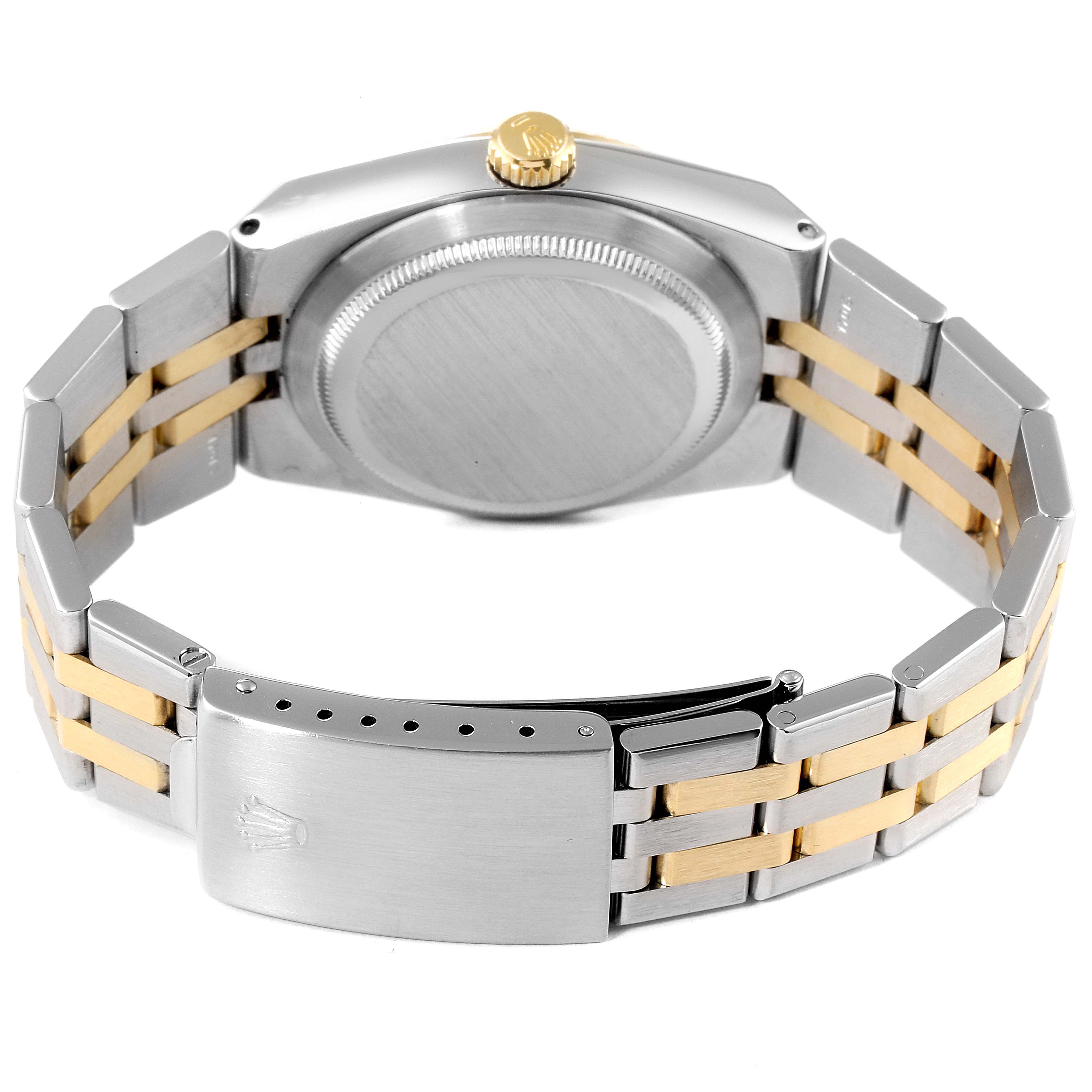 The image shows the back of a Rolex Oysterquartz 17013 Men's Steel and Gold (two tone) Silver Dial 17013 Men's Steel and Gold (two tone) Silver Dial watch, highlighting its case back, crown, and bracelet with the clasp.