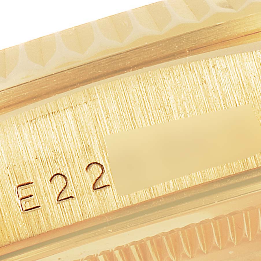 This close-up image shows the etched markings on the side of a Rolex President 18238 Men
s Yellow Gold Champagne Dial 18238 Men
s Yellow Gold Champagne Dial watch.