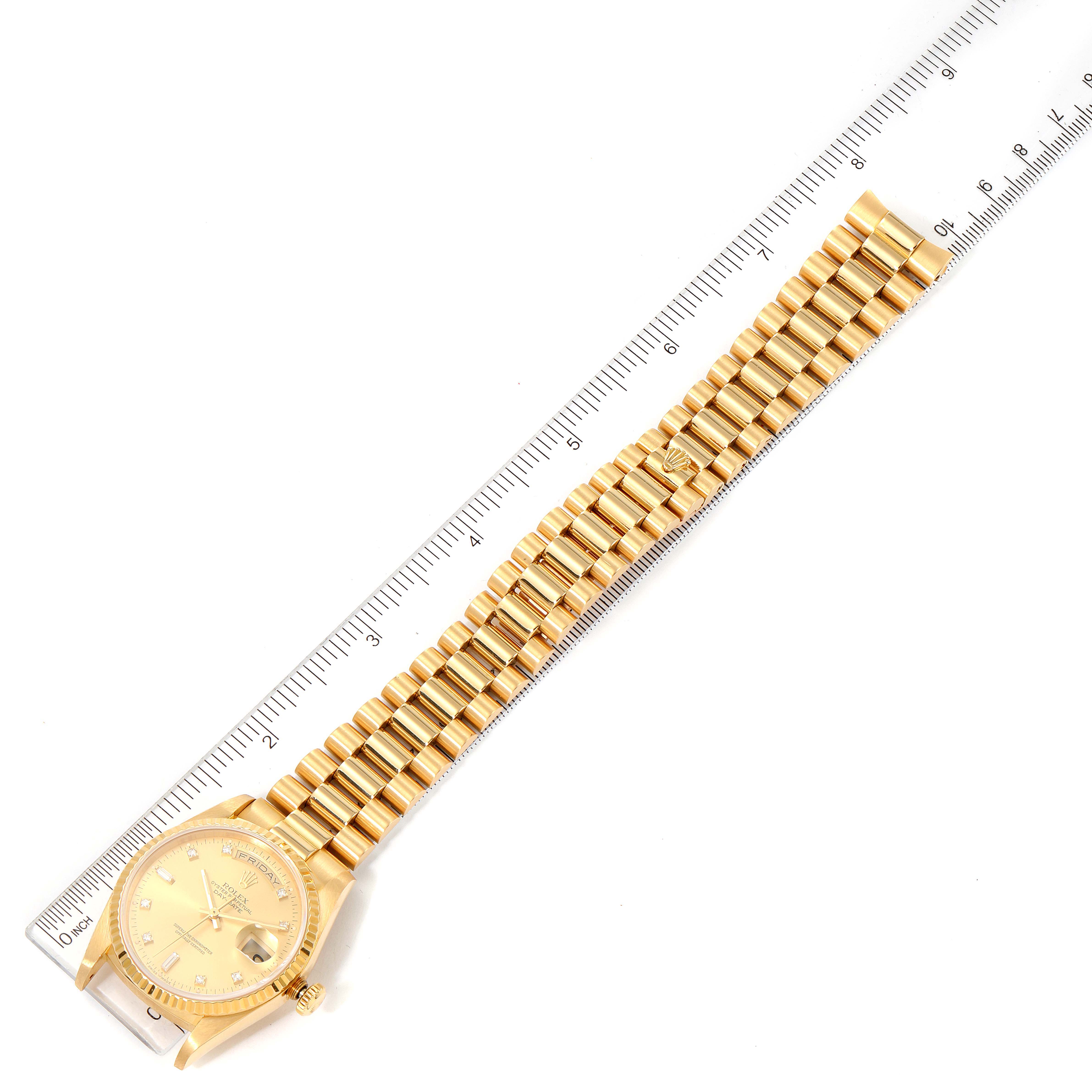 The image shows the strap and face of a Rolex President 18238 Men
s Yellow Gold Champagne Dial 18238 Men
s Yellow Gold Champagne Dial model watch, displayed alongside a measuring ruler.