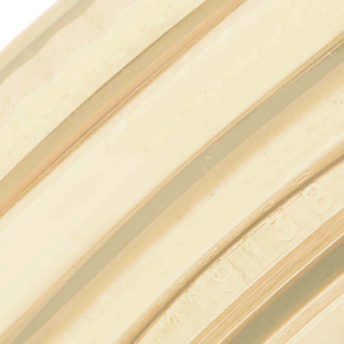 This close-up image shows part of the Rolex President 118138 Men's Yellow Gold Green Dial 118138 Men's Yellow Gold Green Dial's fluted bezel and possibly the edge of the bracelet.