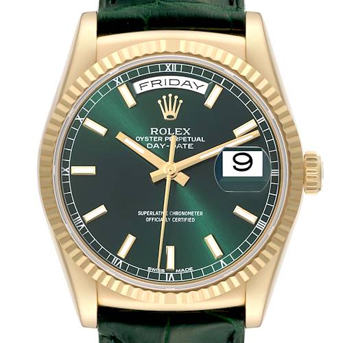 This image shows a front view of the Rolex President model watch, highlighting its green dial, gold indices, and fluted bezel.