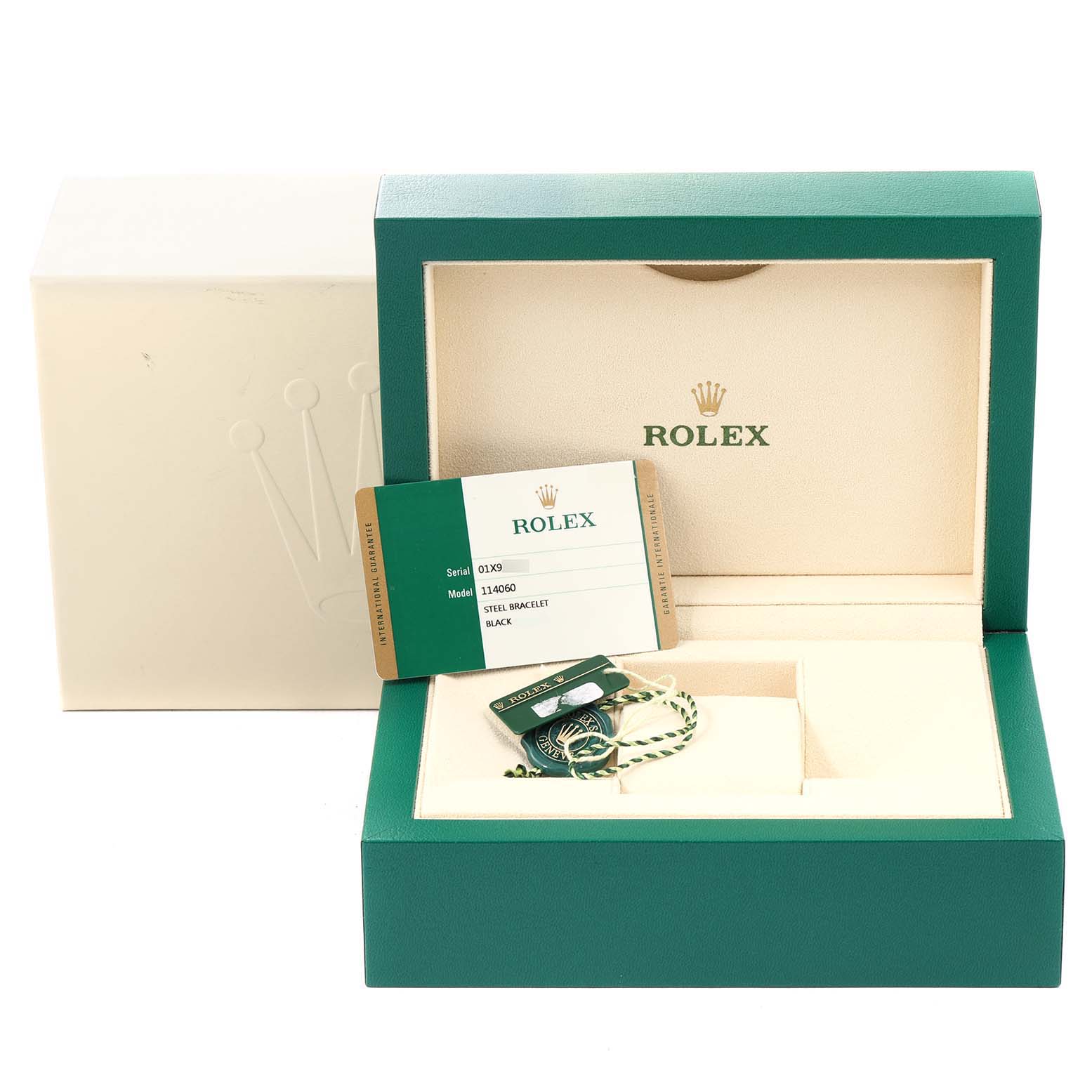 The image shows the open box for a Rolex Submariner 114060 Men
s Stainless Steel Black Dial 114060 Men
s Stainless Steel Black Dial watch, displaying the warranty card and accessories inside the box.