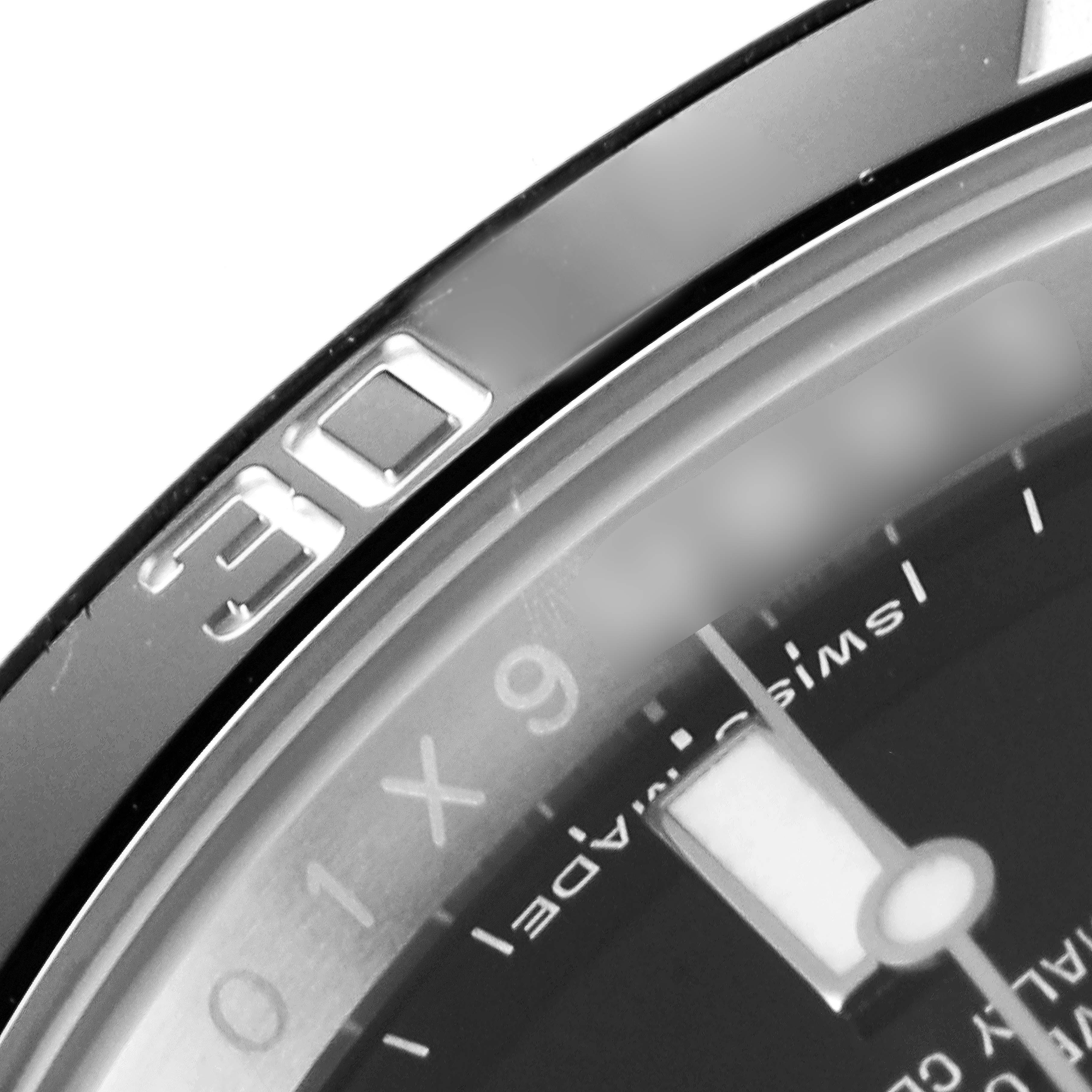 This image shows a partial close-up of the bezel and dial of a Rolex Submariner 114060 Men
s Stainless Steel Black Dial 114060 Men
s Stainless Steel Black Dial watch, highlighting the "30" marker and part of the minute scale.