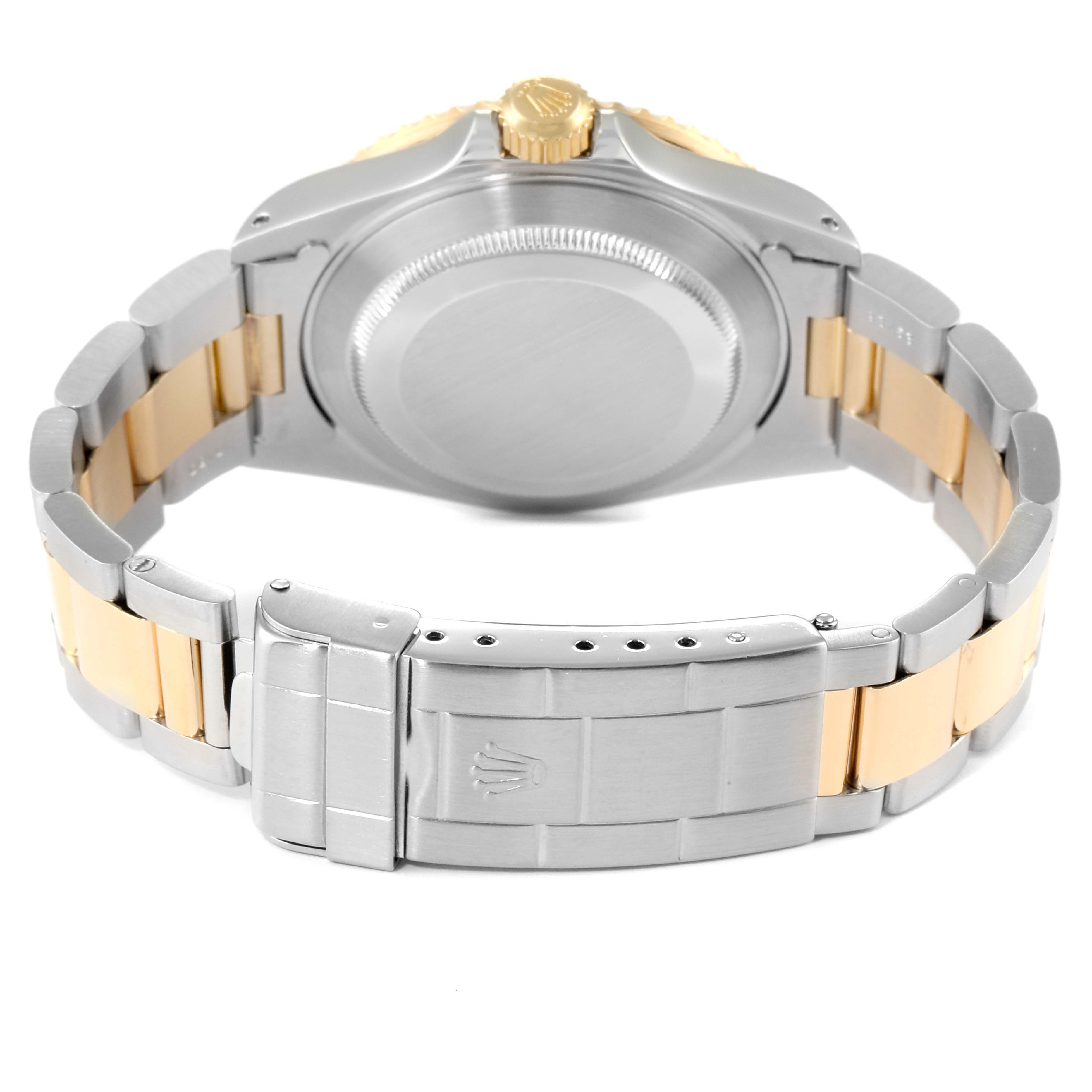 The image shows the back view of a Rolex Submariner 16613 Men
s Steel and Gold (two tone) Black Dial 16613 Men
s Steel and Gold (two tone) Black Dial watch, highlighting its clasp and bracelet.