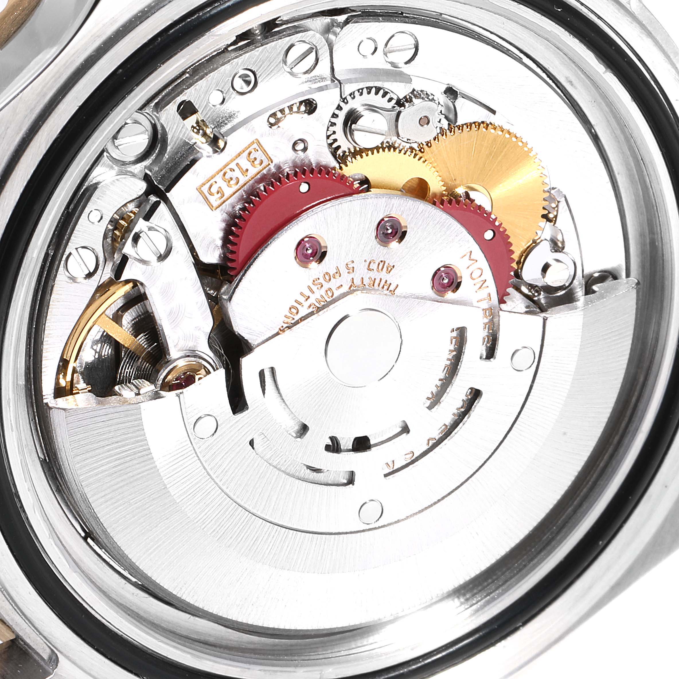 The image shows a close-up of the movement mechanism of a Rolex Submariner 16613 Men
s Steel and Gold (two tone) Black Dial 16613 Men
s Steel and Gold (two tone) Black Dial watch.