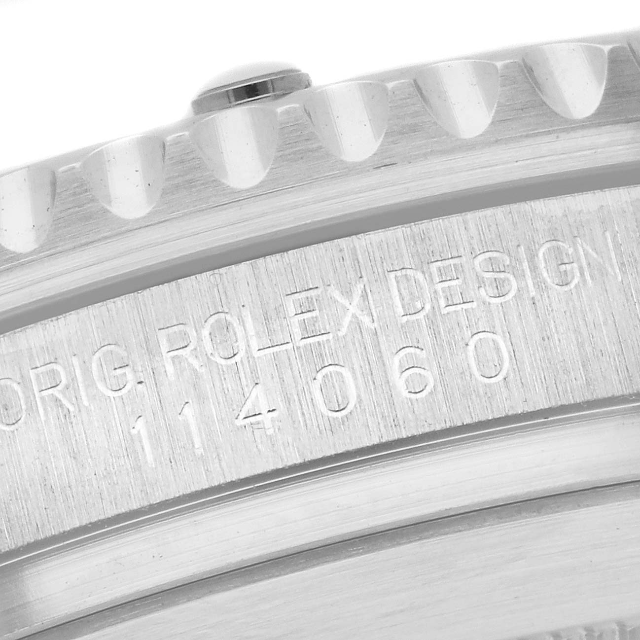 This close-up image shows the edge and case back engraving of a Rolex Submariner 114060 Men
s Stainless Steel Black Dial 114060 Men
s Stainless Steel Black Dial watch.