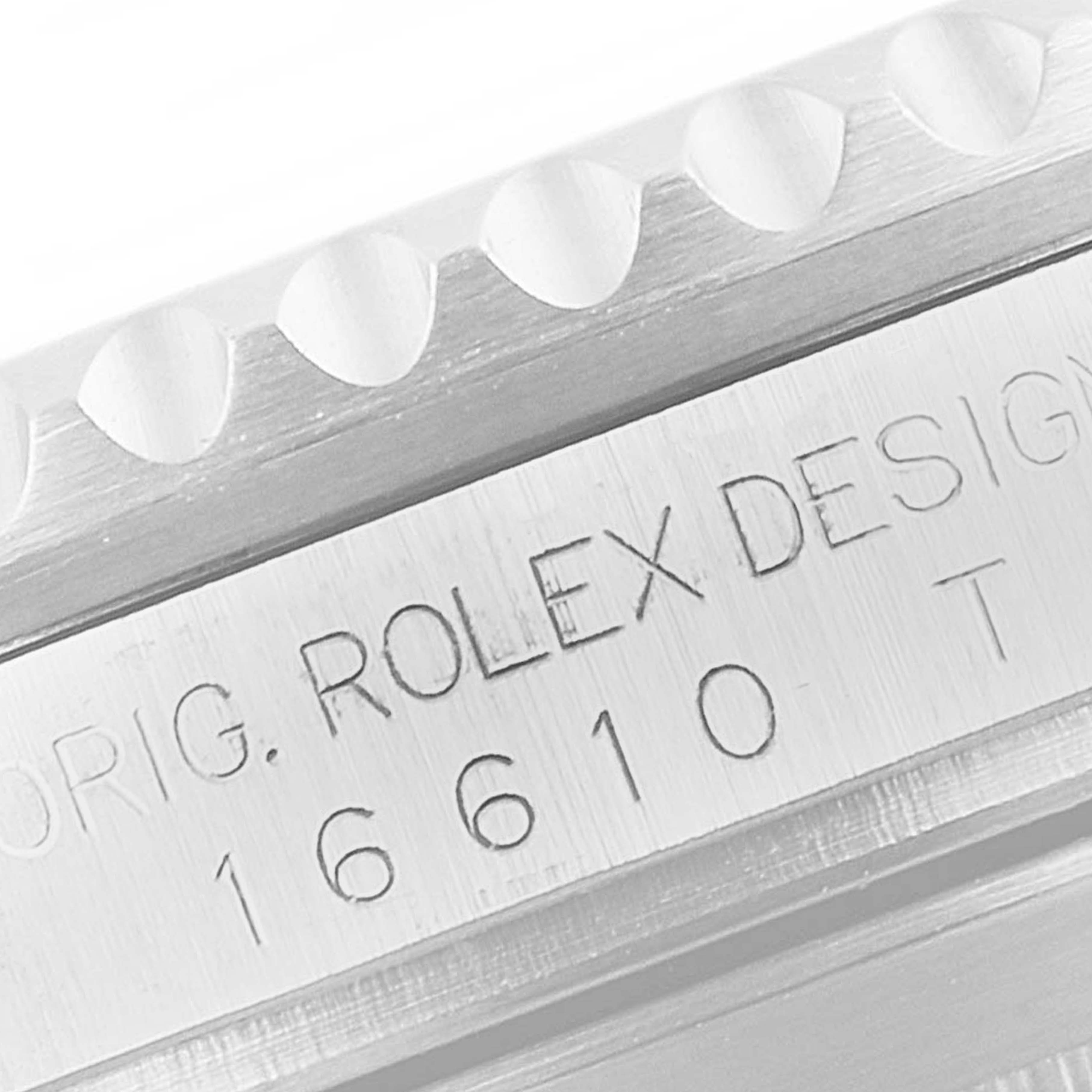 This image shows a close-up of the side of a Rolex Submariner 16610 Men
s Stainless Steel Black Dial 16610 Men
s Stainless Steel Black Dial, displaying its engraved model number and design.